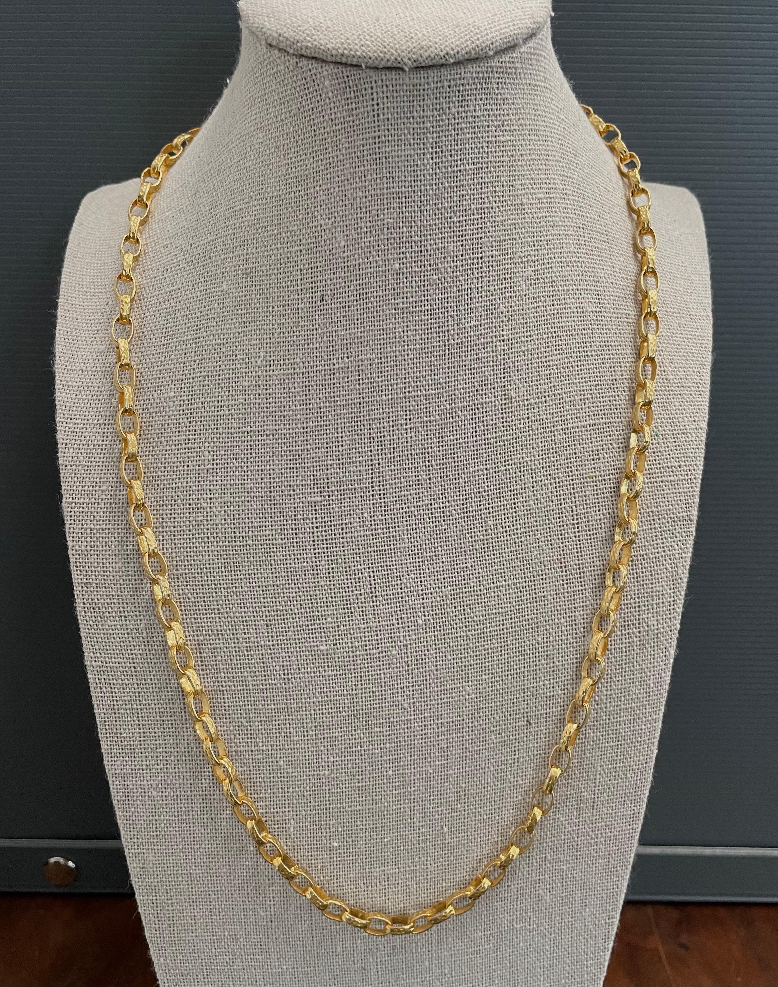 This is a more substantial version of our most popular style gold chain. It has really nice weight and feel.  The hand hammered links are approximately 1.3 mm wide. Rich 18K gold color. 