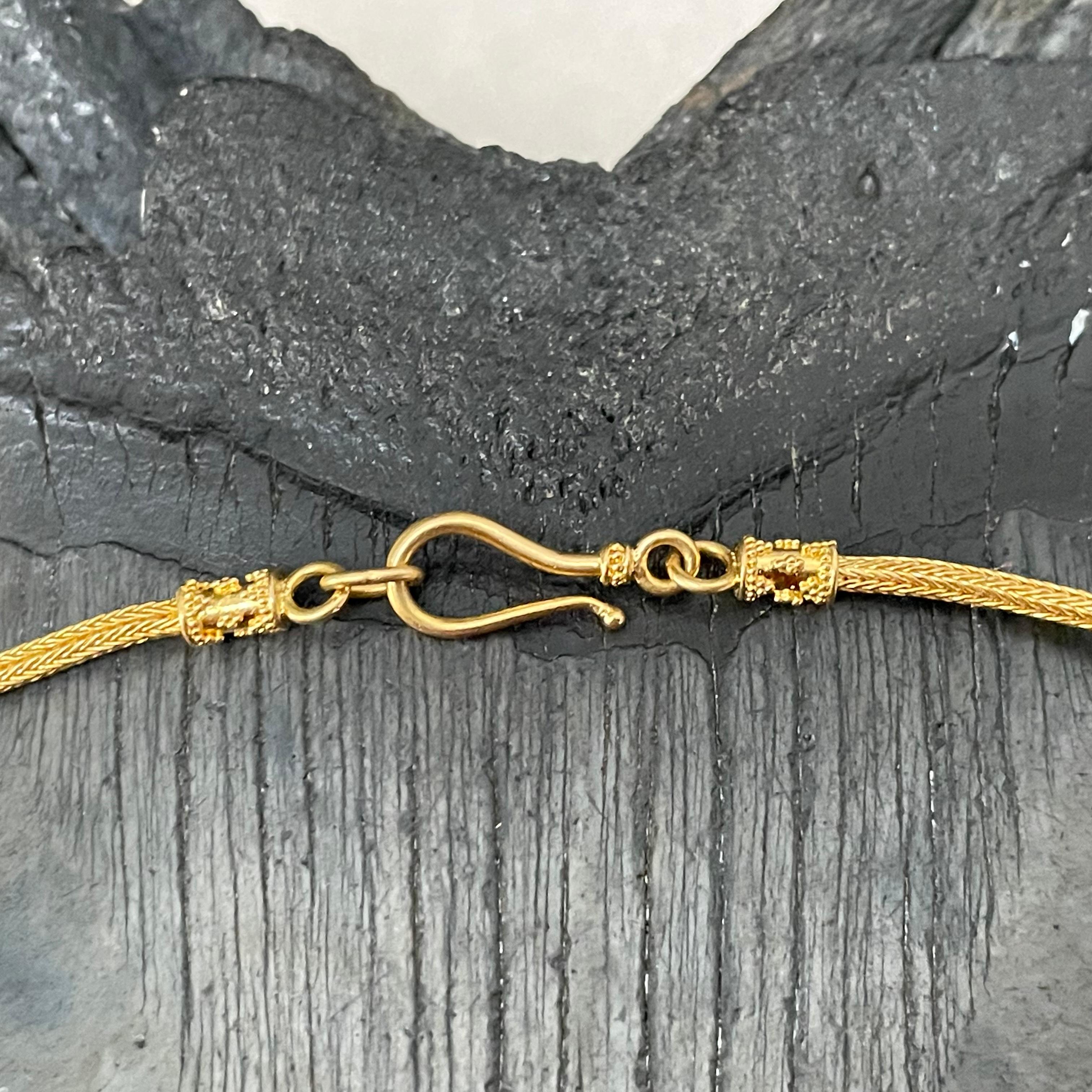 A beautiful, elegant, and classic chain to display and accent your most precious pendant (or all by itself ! ).  Geometrically granulation accented end caps with easy and safe-fastening bendable hook.  1.8 mm thickness. super nice!
