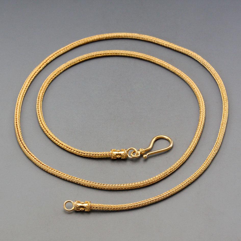 A beautiful, elegant, and classic high-karat woven chain to display and accent your most precious pendant (or all by itself).   Granulation accented end caps with easy and safe-fastening bendable hook.  Substantial 1.8mm thickness.   Super nice !
