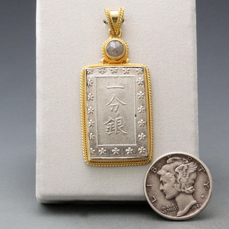An interesting rectangular coin from the last Japanese shogunate, minted in the waning days of their power 1837-1854, is set in classic double braid setting with a 4mm rough rose cut diamond accent.  The coin is a an 
