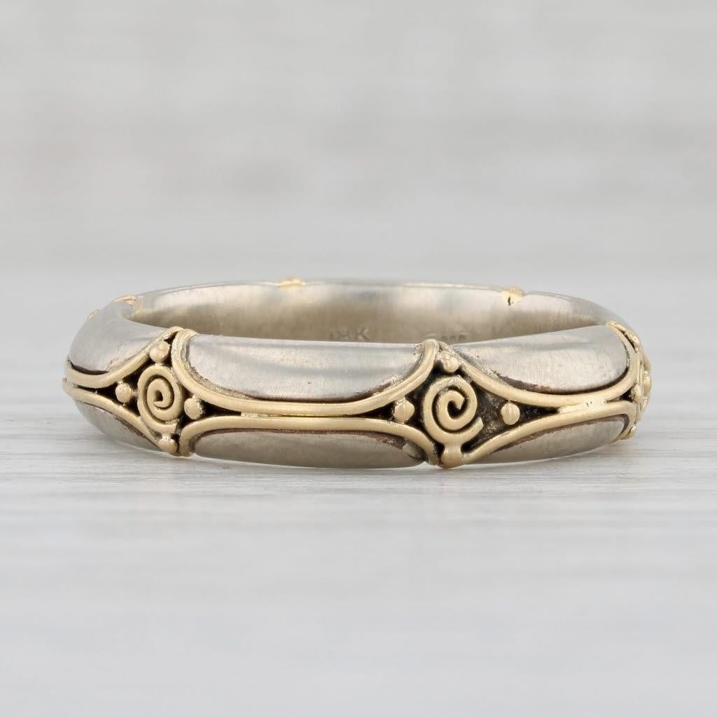 Metal: 18k Yellow Gold, 14k White Gold
Weight: 8.4 Grams 
Stamps: 18k 14k Battelle
Band Width: 5.3 mm 
Rise Above Finger: 2.8 mm

This ring is a size 9 3/4.