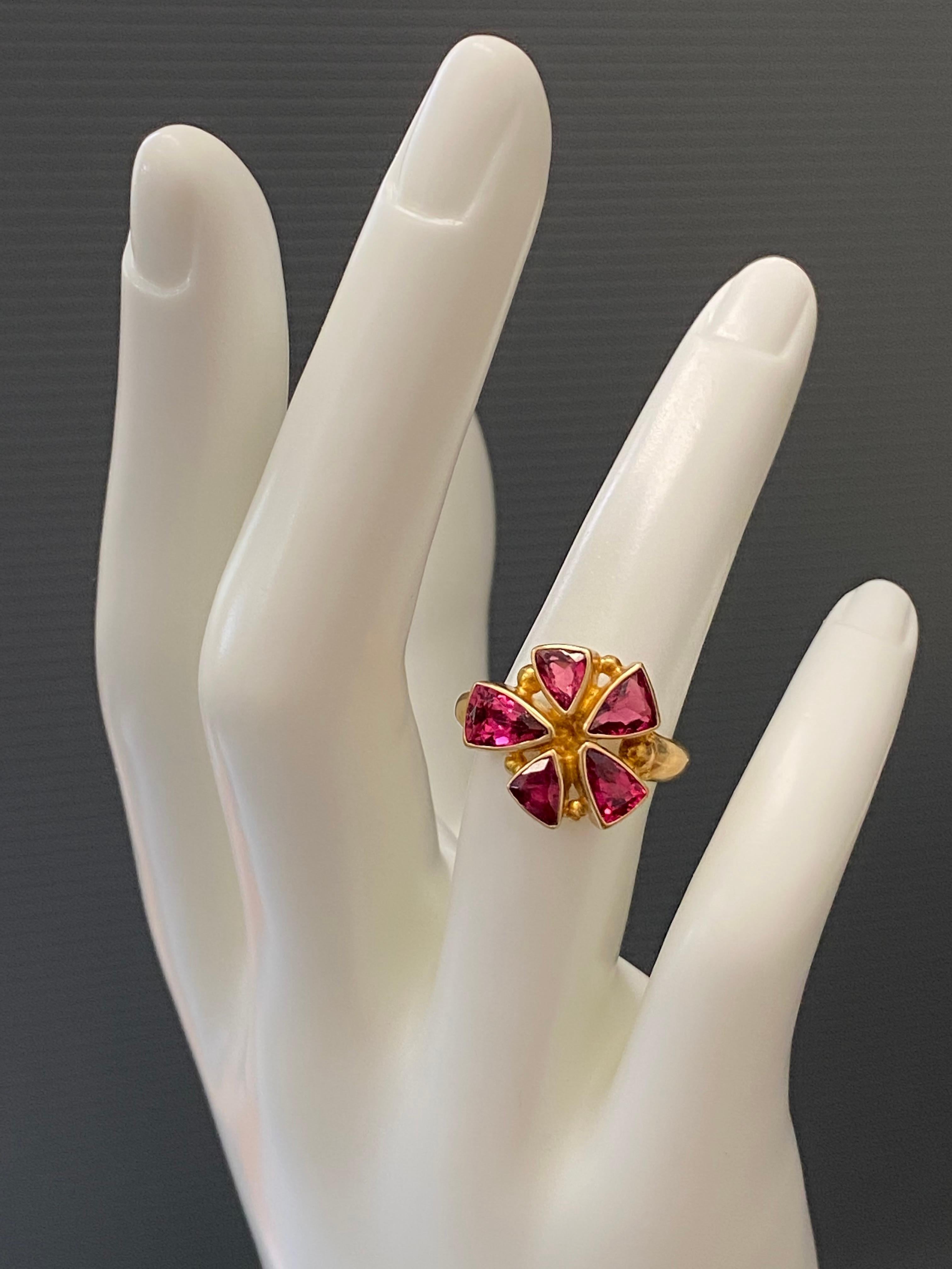 Lovely handcrafted Steven Battelle 2.5 carat multi-stone Pink Tourmaline ring in 18K Gold.
Pretty pink. This hot pink tourmaline is a must add to your collection.
Stones sizes approximately 4x6mm to 5x7mm trillium.
Ring size 6.75. Can be resized.


