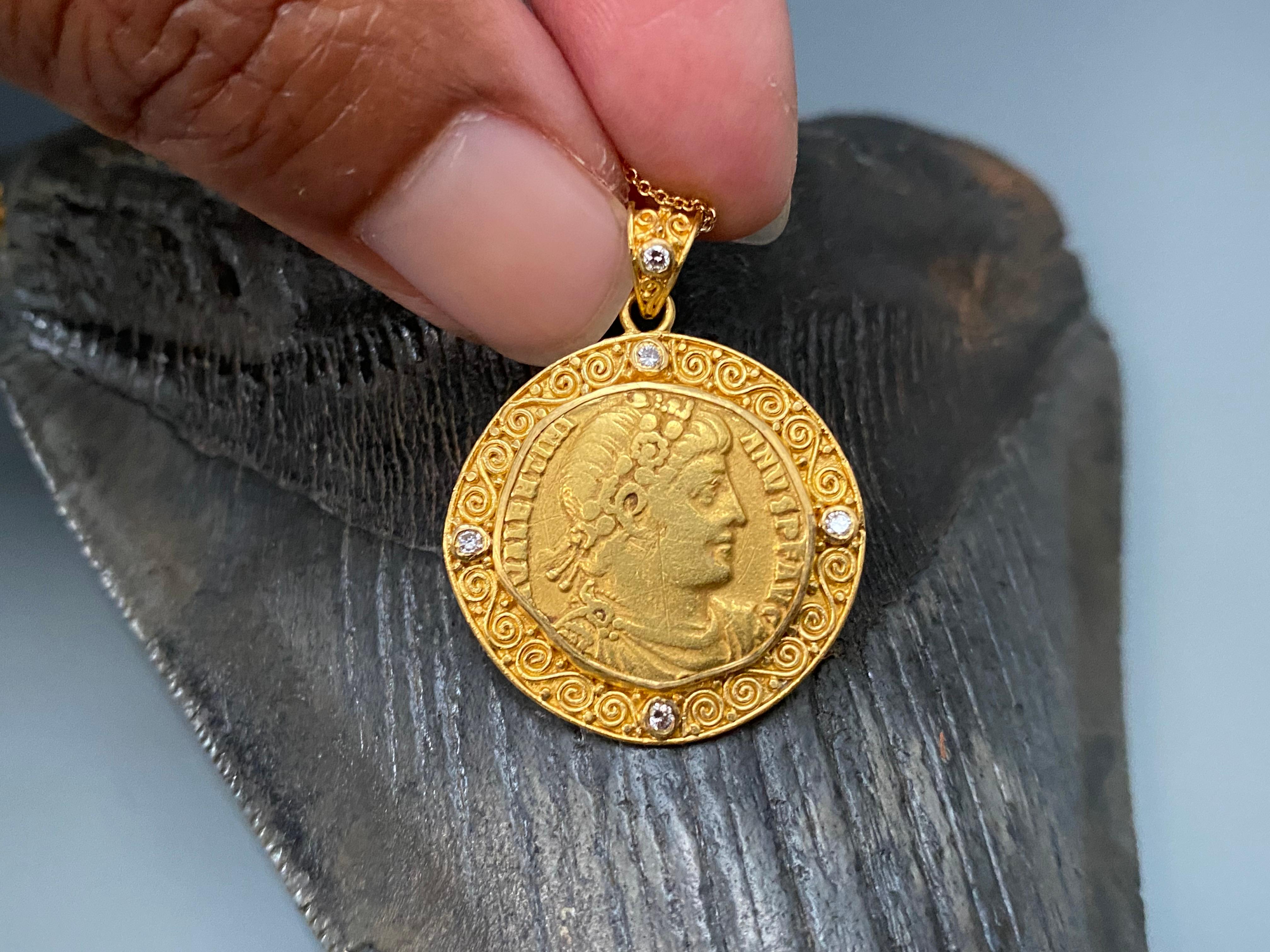 A authentic gold solidus from the Roman Empire of emperor Valentian I (364-75 AD) is complemented with five 1.8 mm diamonds in an ancient inspired multi-spirals handmade 22K pendant.  A ancient/modern treasure.  Due to the successful nature of his