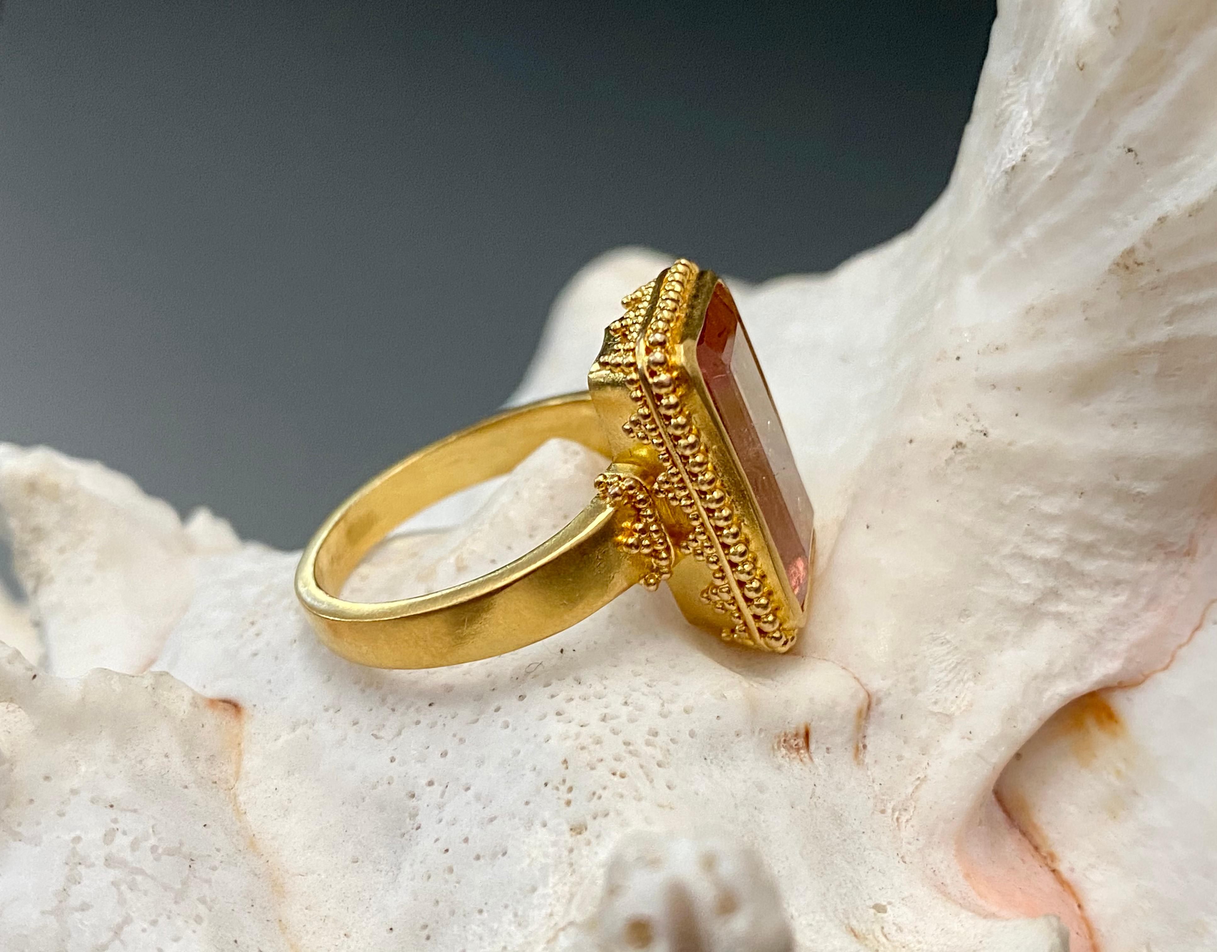 Delicate geometric granulation surrounds this juicy pinkish 9 x 14 mm Brazilian watermelon tourmaline faceted octagon.  Lots of light and internal reflection makes for a very lively stone.  Handmade in matte-finish 22K gold in our signature 