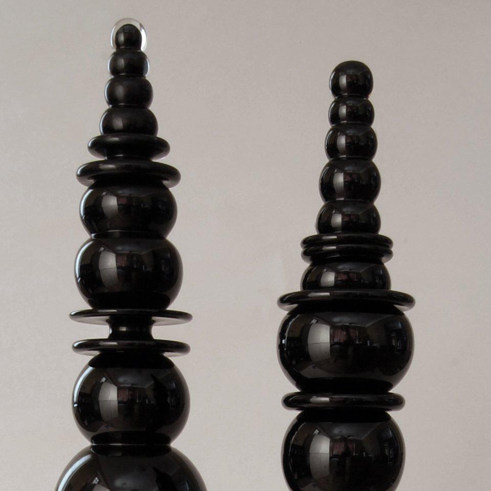 This striking set of two objects is by Steven Ciezki who is known for his blown glass tower sculptures. 