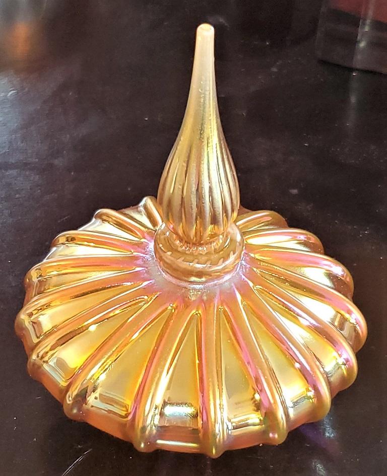 Presenting a beautiful Steven Correia bulbous art glass perfume bottle.

American, circa 1980.

Luminescent yellow/orange/gold bulbous base with ribbed detail and original ribbed and fluted stopper.

Fully signed and marked with serial numbers