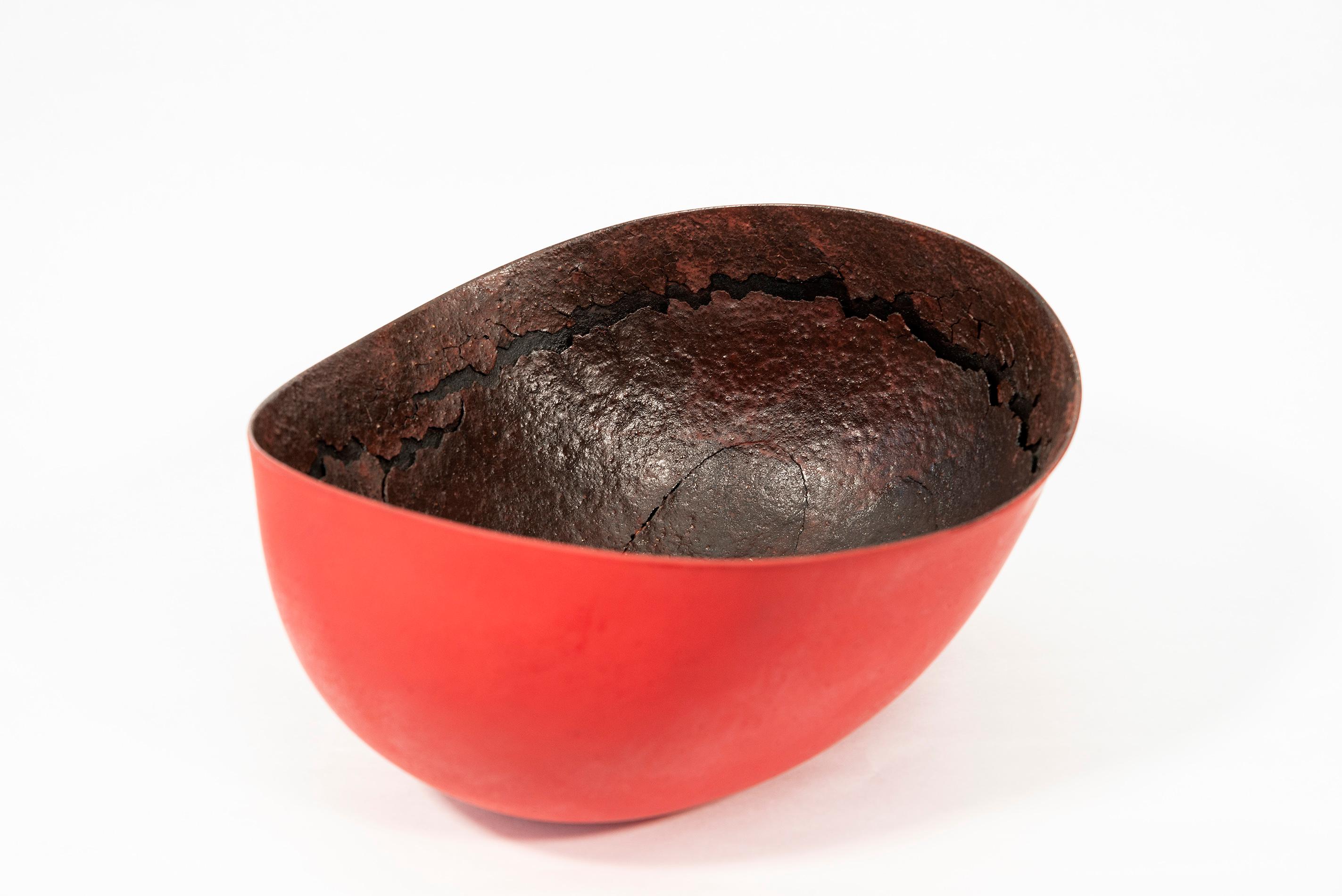 Master ceramicist Steven Heinemann continues his exploration of the potential of the vessel, an ancient form, with this series of untitled pieces. The organic oval shape is inspired by nature. The bright red exterior offers a vivid contrast to the