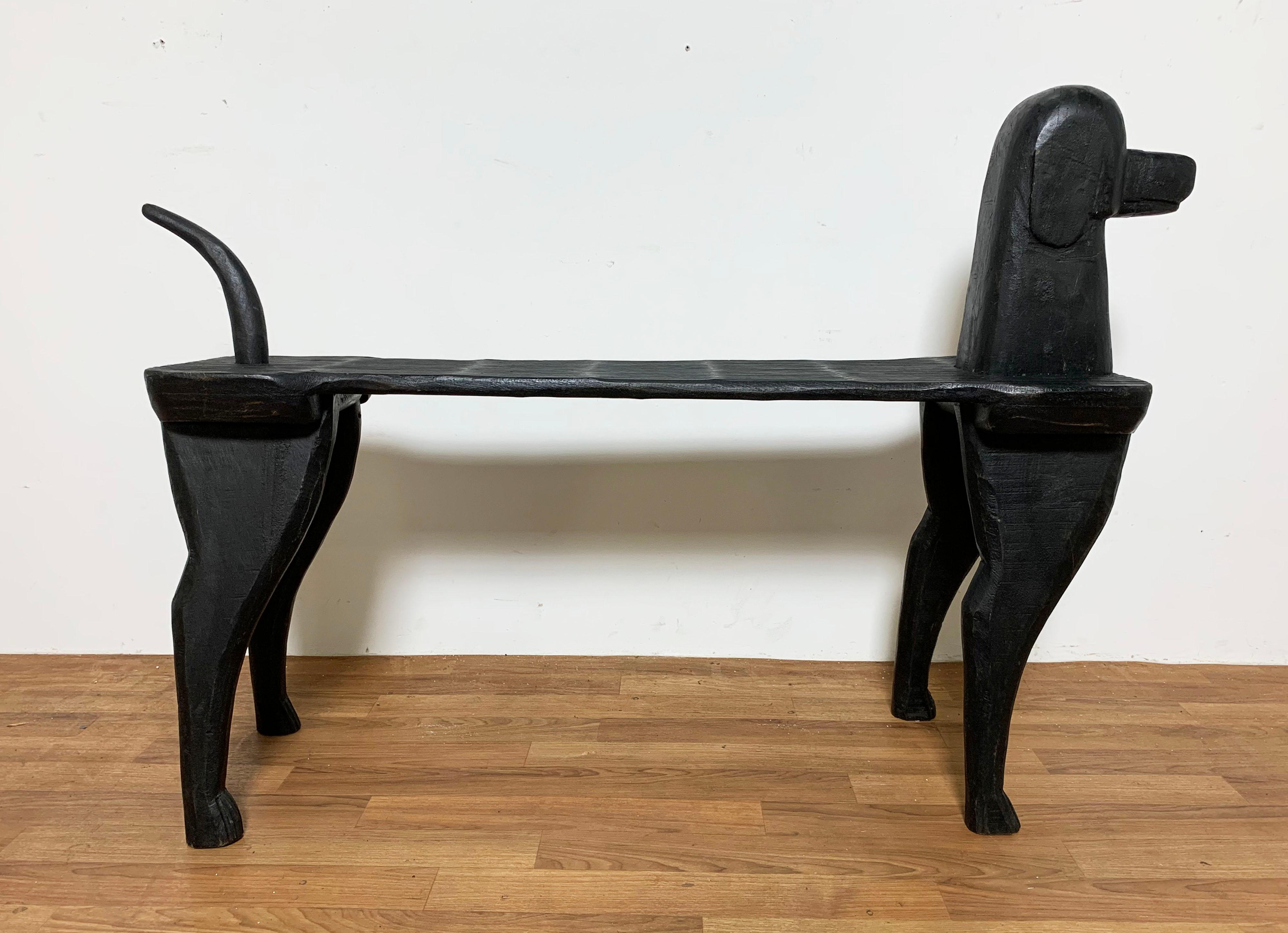 Hand carved Folk Art bench in the form of a Labrador retriever by the celebrated Vermont artist and wood carver Stephen Huneck, ca. 1990s. 

Huneck was a fascinating wood carver, painter, antiques dealer and author who devoted much of his later