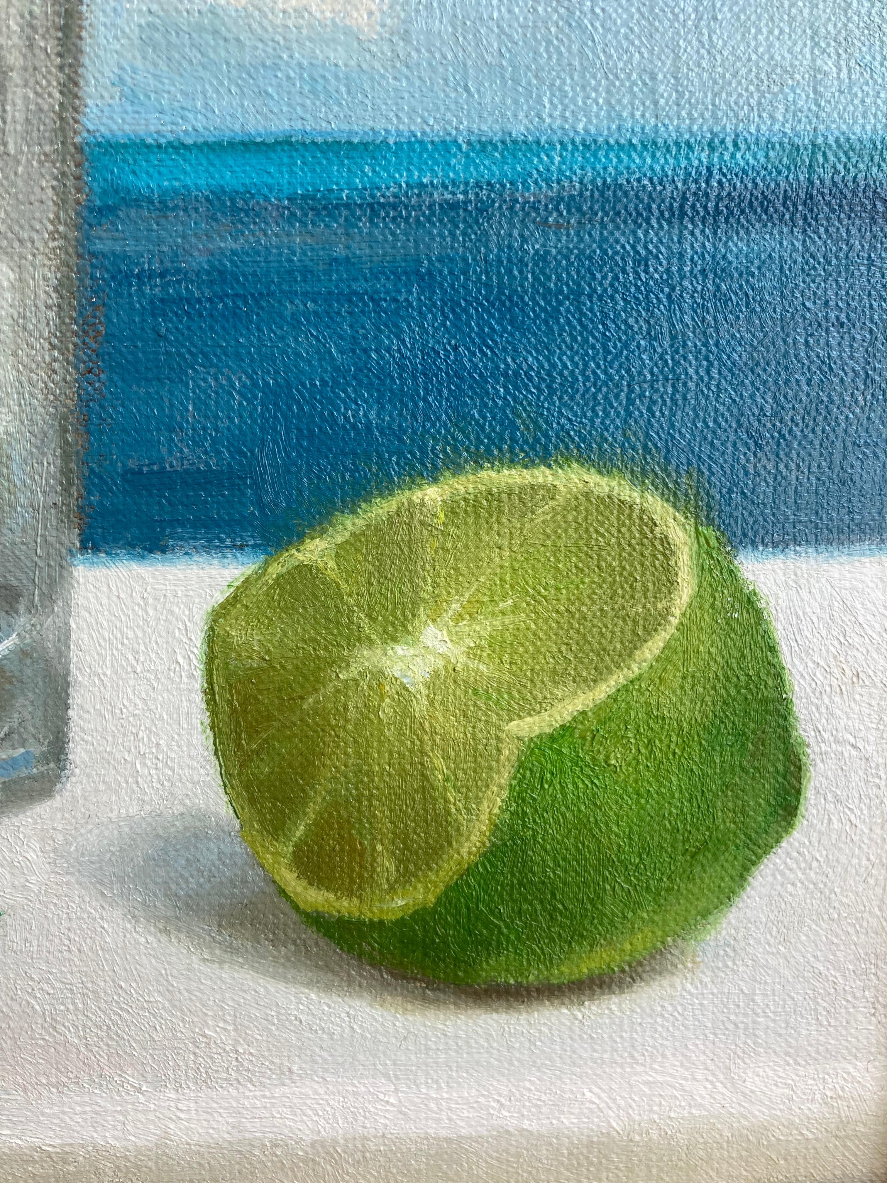 An oil painting by American Realist painter, Steven Levin. Here, Levin depicts a still life that transports viewers to a tropical island with his realist image of gin and tonic against a seascape background. Framed in a simple black frame.
