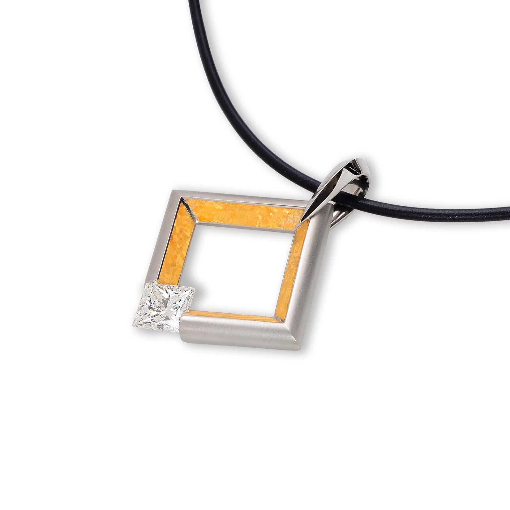 The Steven Kretchmer Large Square Pendant is crafted in our patented matte platinum with a 24K crystallized yellow gold inlay.  The pendant features a 2.03 ct. J/VS1 princess cut diamond tension-set right in the center. The bail of the pendant is