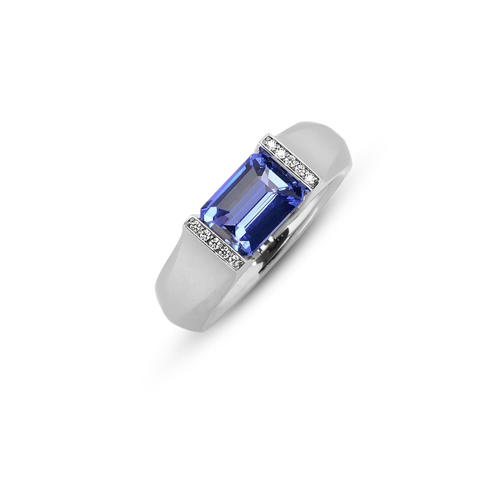 The Steven Kretchmer Softened Hard Omega Ring with a tension-set cornflower blue sapphire is handcrafted in platinum with a matte finish. The 2.33 ct. emerald cut sapphire is a saturated, traditional cornflower blue. The 