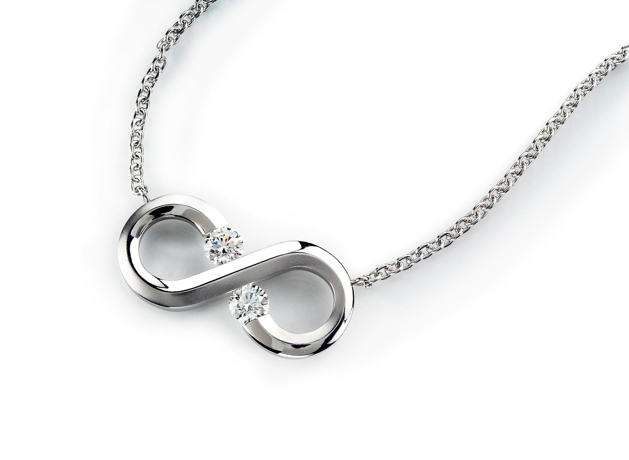 The Steven Kretchmer Small Horizontal Infinity Necklace with tension-set diamonds is handcrafted in a half-matte platinum. The Infinity Pendant features two 3.5mm F/VS round brilliant diamonds (0.32 ctw.) and measures 0.35 in tall and 0.80in wide.