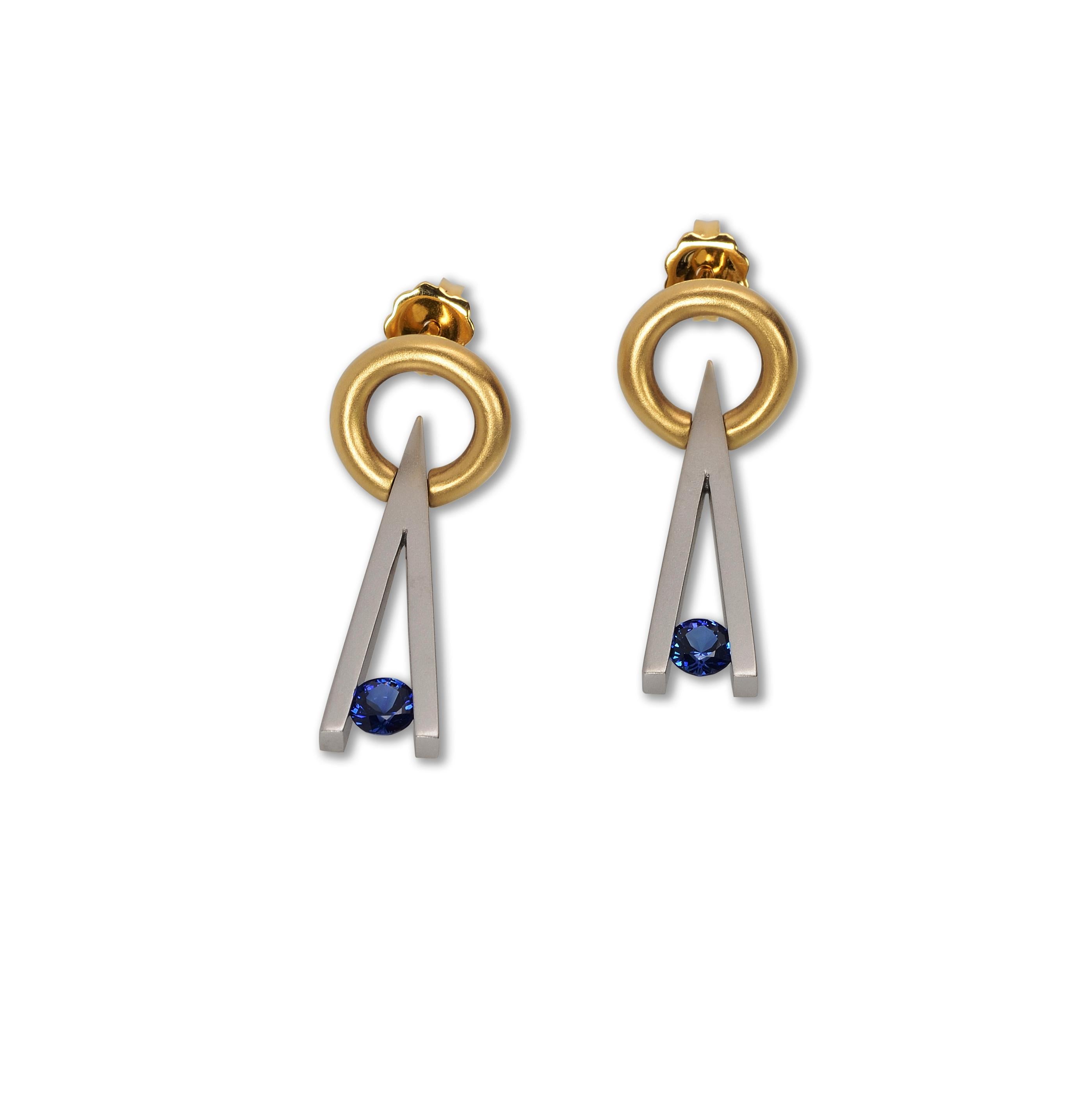 Round Cut Steven Kretchmer Swinging V Tension-Set Earrings with Blue Sapphires For Sale