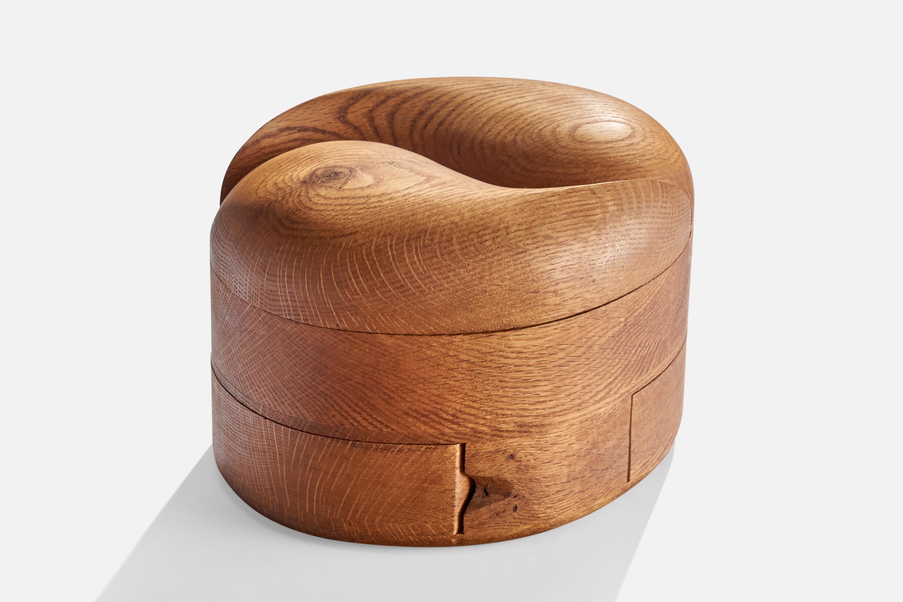 A carved oak jewelry box designed and produced by Steven Spiro, USA, c. 1970s.
