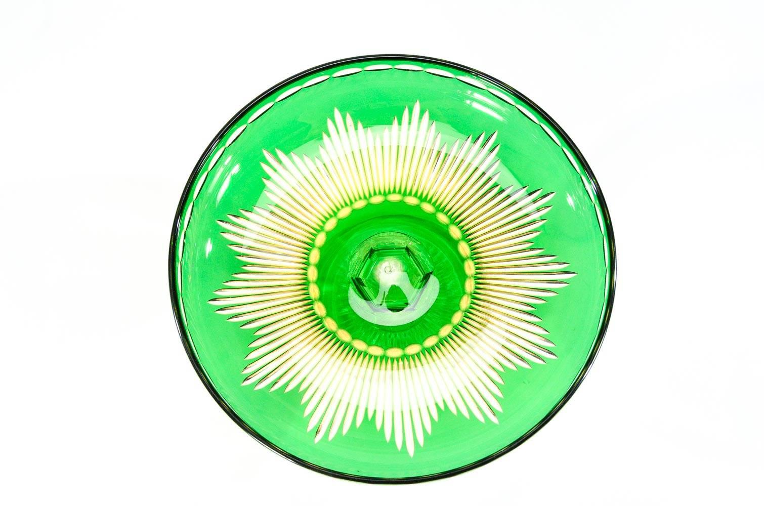 This rare pair of hand blown crystal compotes feature 2 overlay colors, vibrant apple green cut to saffron, cut to clear with a starburst pattern. The compotes are paired with 6 matching dessert plates to create a dramatic dessert service. The