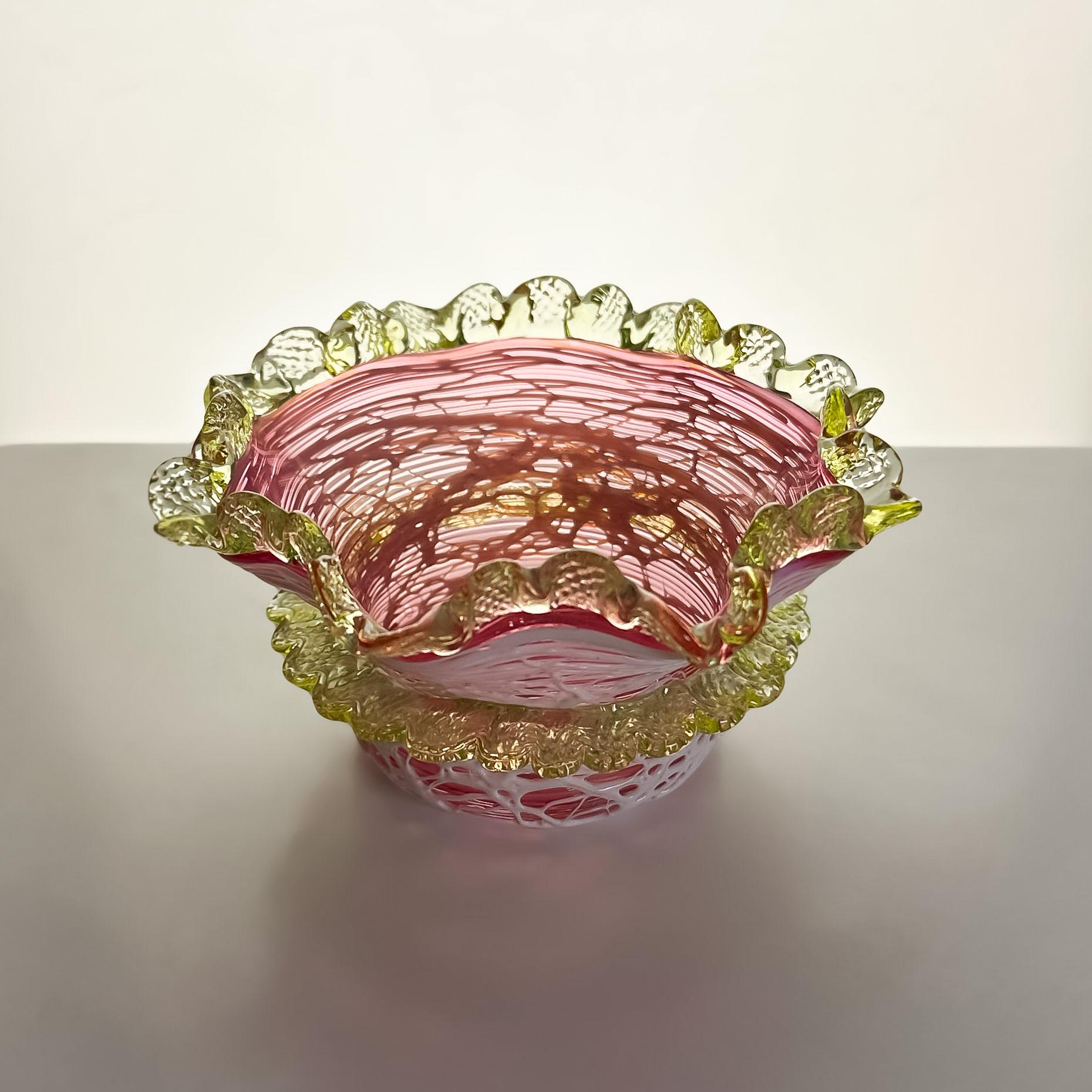 A late Victorian cranberry and uranium glass bowl, crafted by Stevens & Williams, Stourbridge, England, circa 1890.

This decorative bowl exemplifies Stevens & Williams' mastery of Victorian-era glassmaking, particularly through their innovative use