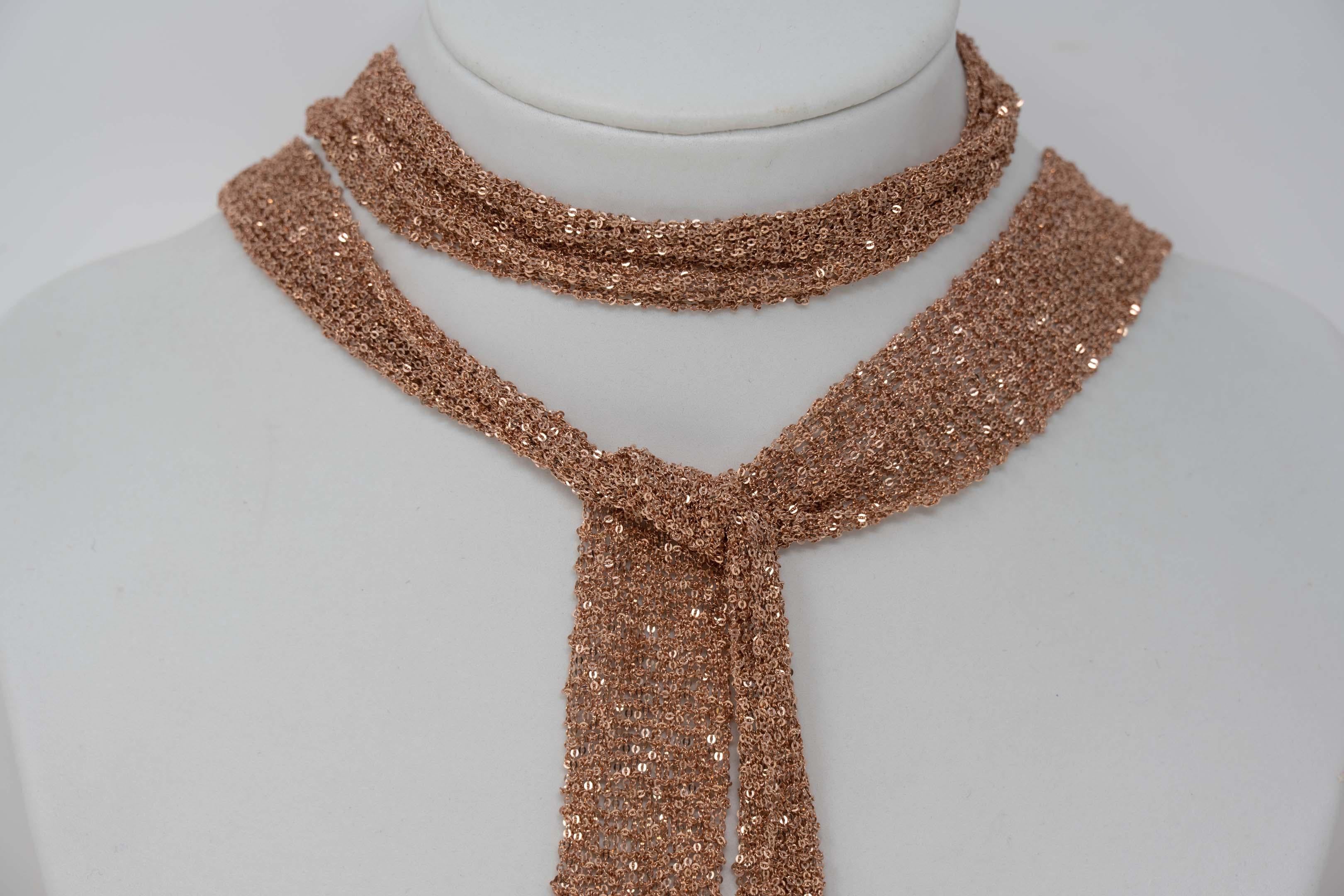 Contemporary 18k rose gold plated 925 silver mesh scarf by Stevie Wren. Measures 38 inches long x 1 inches wide. Stamped 925 with maker mark 5. In good condition.
