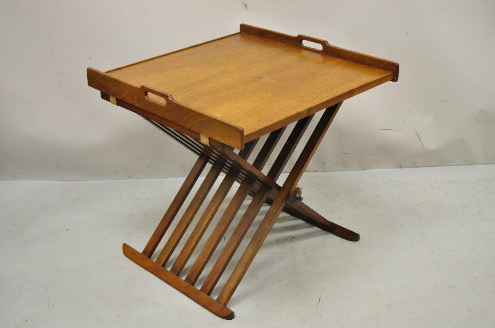 Stewart MacDougall Kipp Stewart Drexel Walnut Folding Campaign Table (B). Item features removable tray top, folding X-form base, carved finials. Circa mid 20th century. Measurements: 20