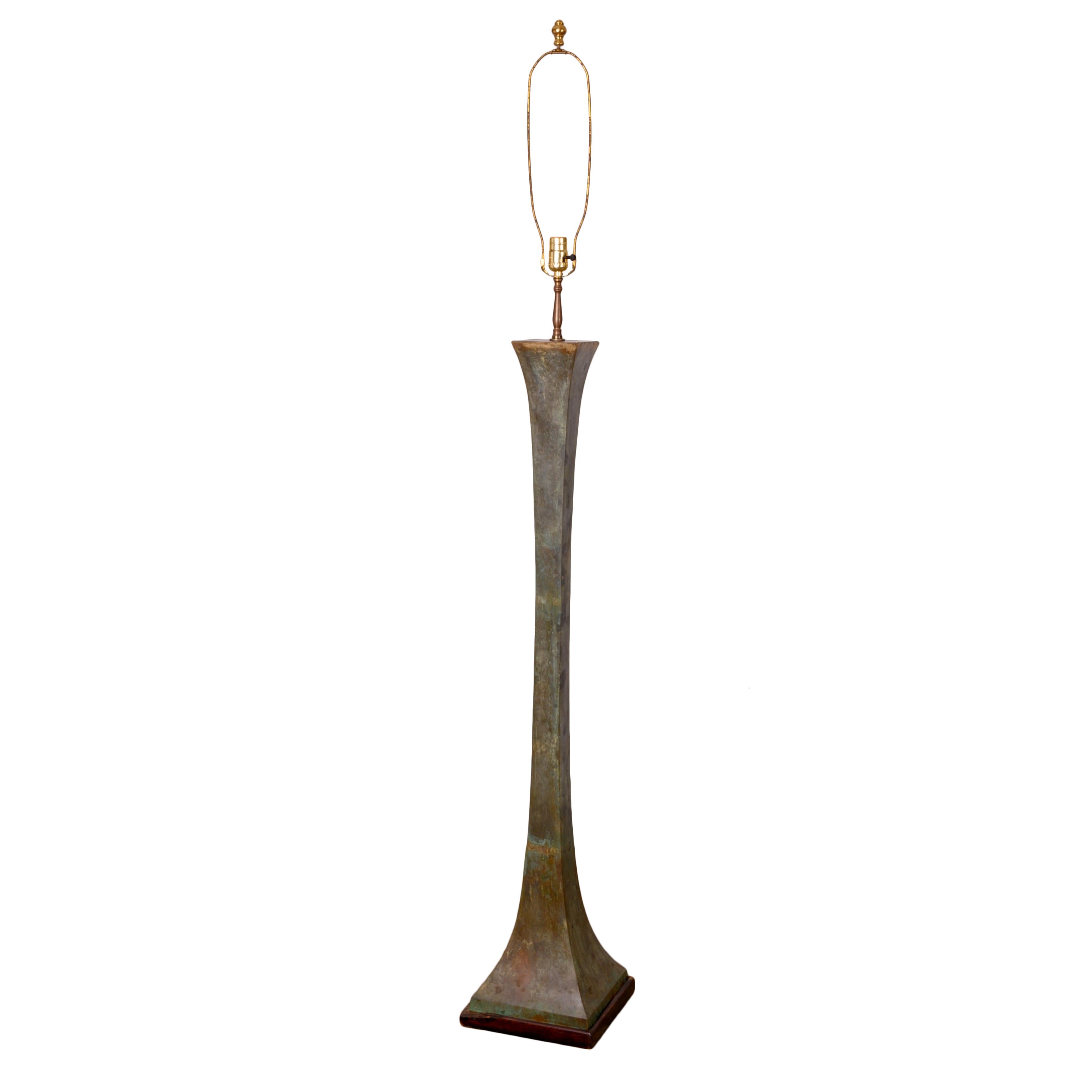 A verdigris bronze floor lamp by Stewart Ross James for Hansen, c.1960s.

10 inches wide and deep by 48 ½ inches tall to top of bronze; 70 inches height to finial.

