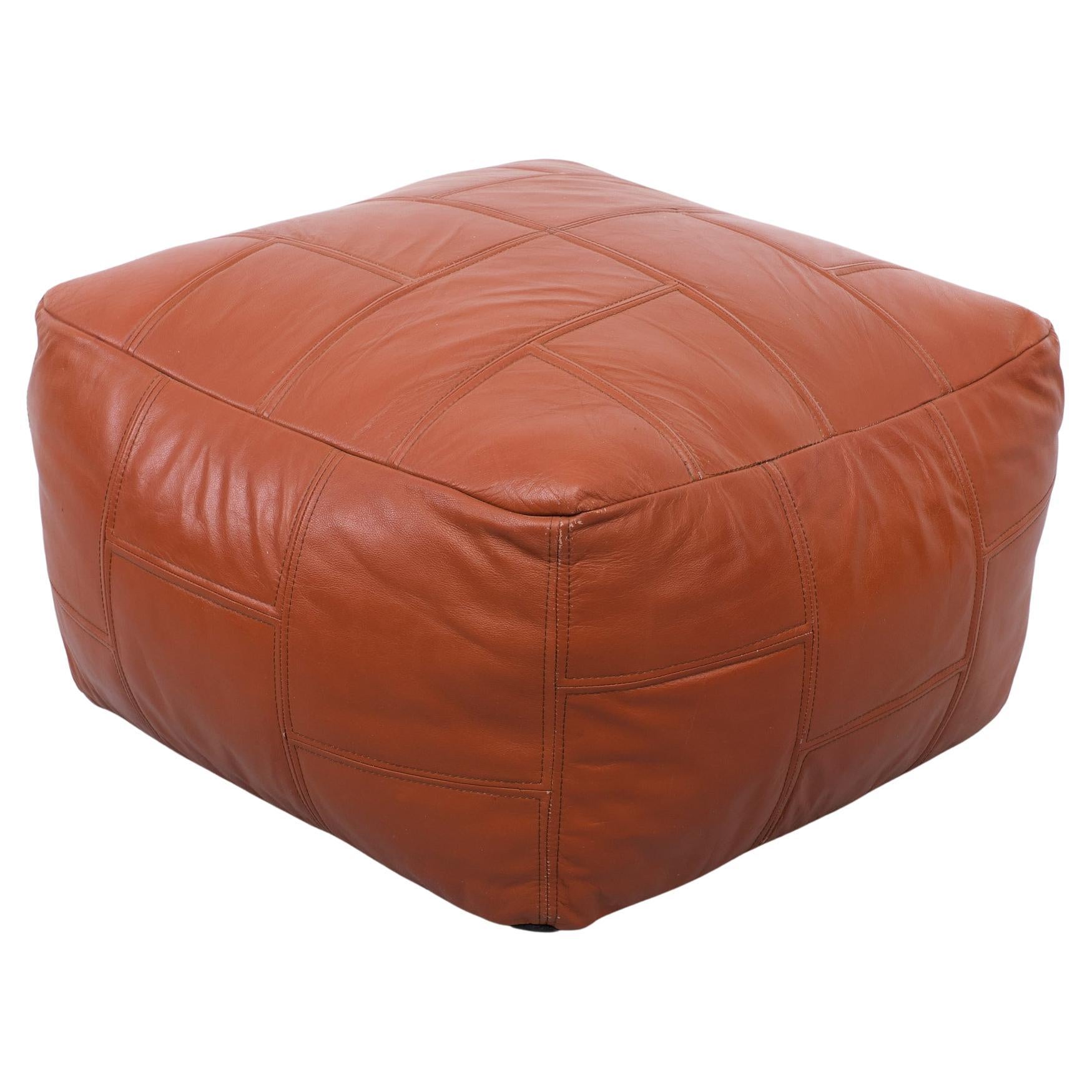 Very nice Stich Leather pouf . Cognac color , 1970s.
For resting your feet or to sit on.

Please don't hesitate to reach out for alternative shipping quote