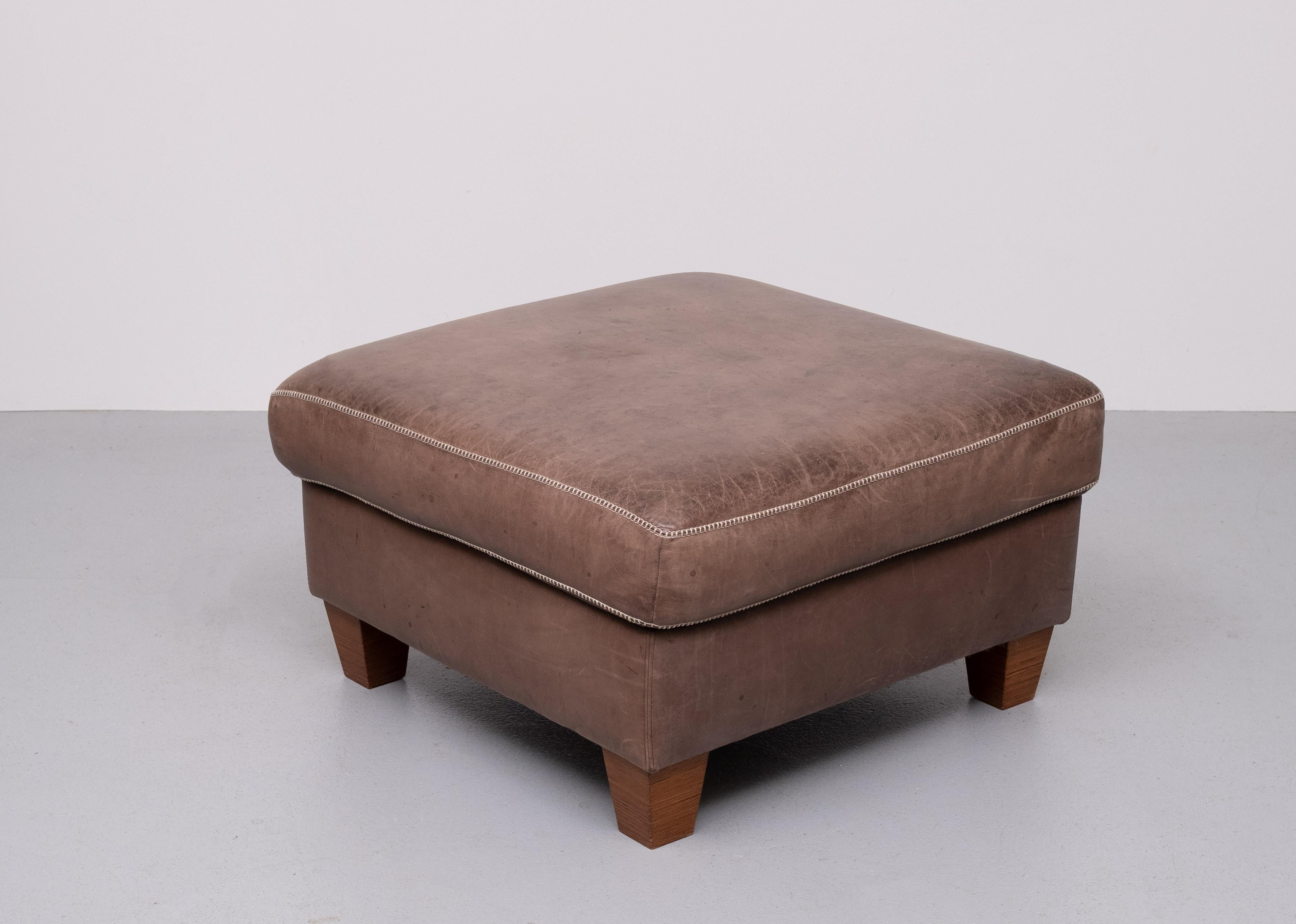 Very nice luxurious Pouf or Ottoman . Stich Leather .  
Beautiful Brown color .Comes with just the right amount of wear . 

 please ask for better shipping solutions . 
 