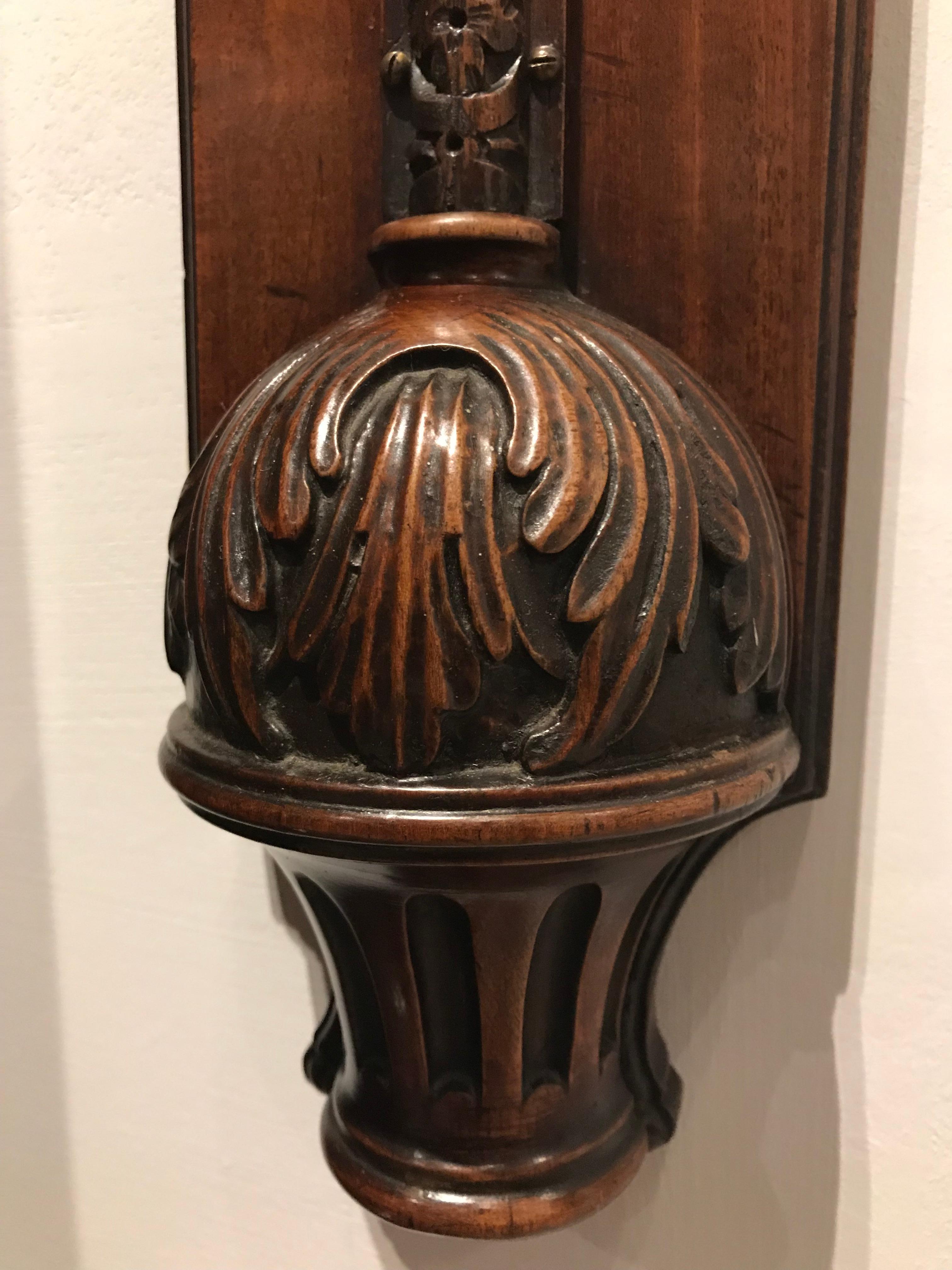 A rare George II period mahogany stick barometer with finely carved cistern cover and surround to partly conceal the mercury tube. Most unusually the signed register plate is made of copper. 
 