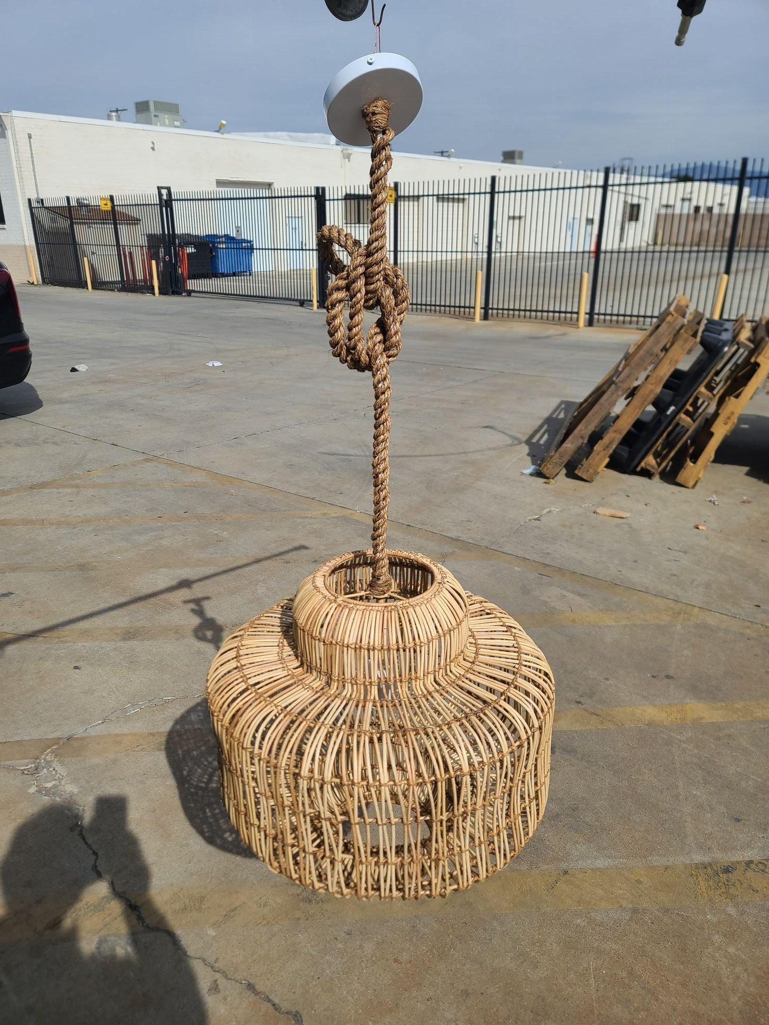 Original near-mint 1990s woven hanging ceiling lamp pendant with raw rust looks perfect to add a little warmth to a loft or modern house. The pendant features a raw woven stick rattan pendant light hung from a bamboo cloth-wrapped cord connected to