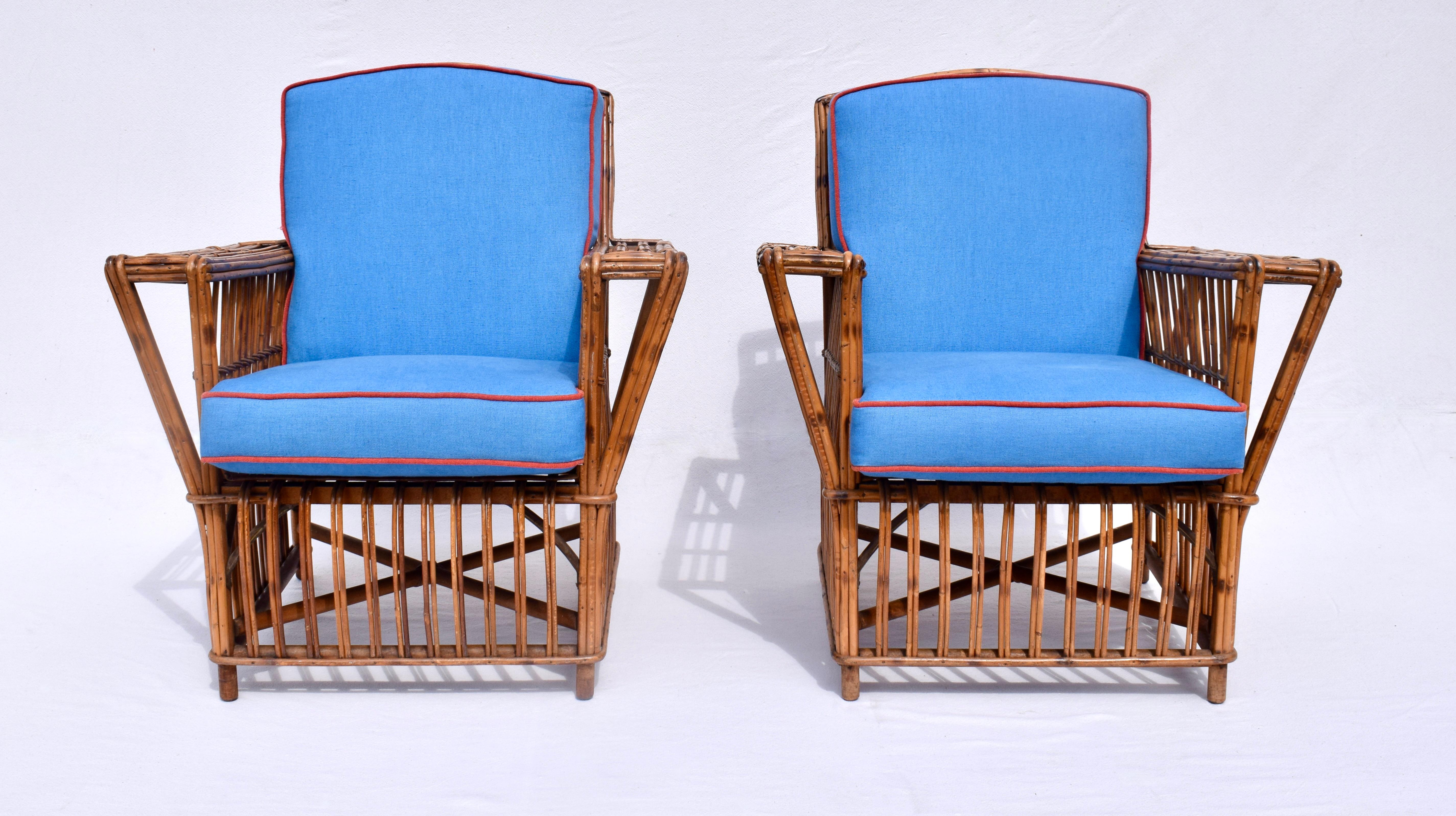 A pair of early 20th c. stick wicker reed rattan lounge chairs with original natural chestnut finish & new custom cushions.  Nice mid size exquisitely maintained & fully hand detailed ready for use. Seat / Arm Dimensions: 18