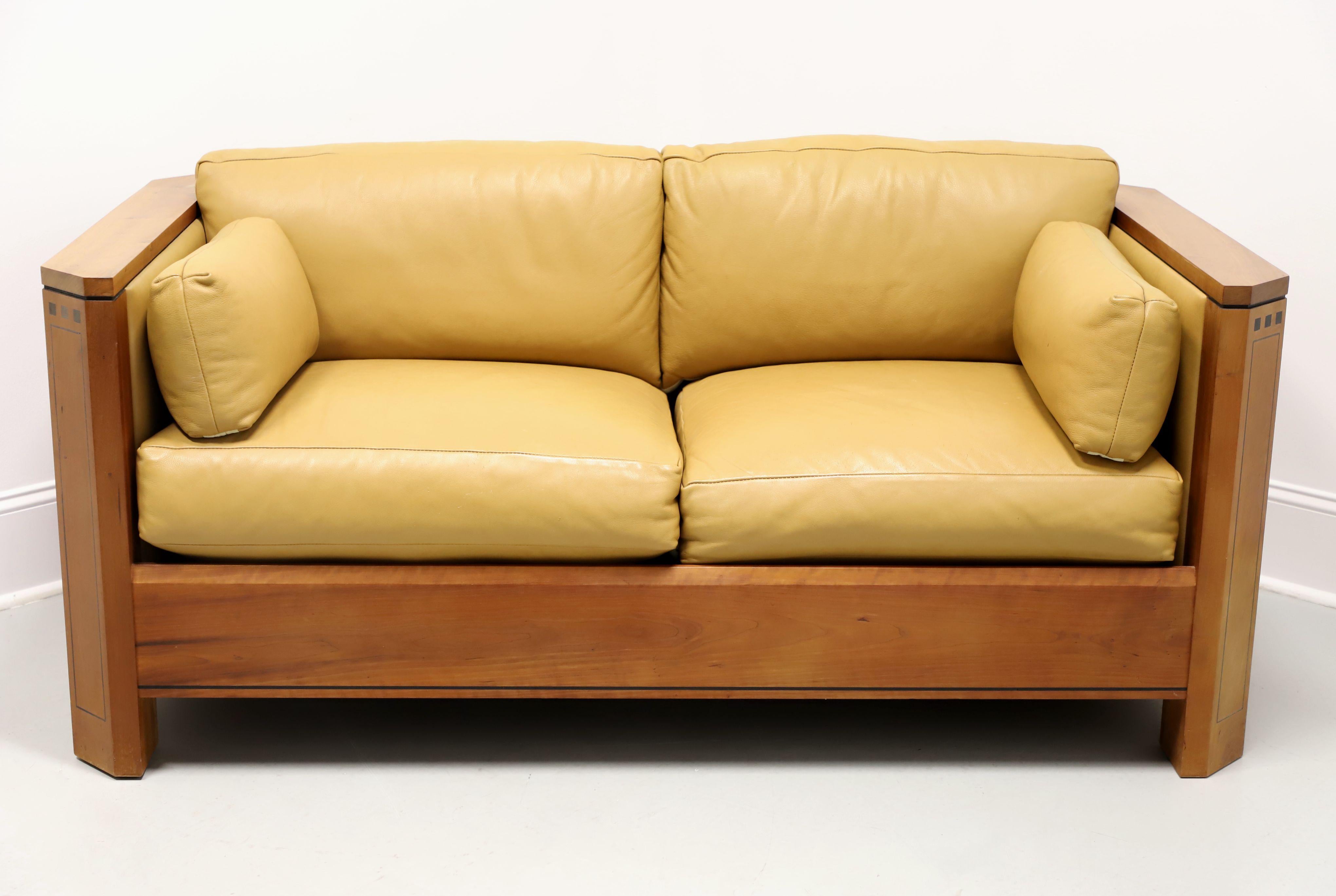 A modern contemporary Arts & Crafts / Mission style loveseat by Stickley Furniture, from their 21st Century Collection. Cherry wood frame (arms, sides, back & apron), inlaid ebonized hardwood accents, chamfered posts, cloth upholstered seat support,