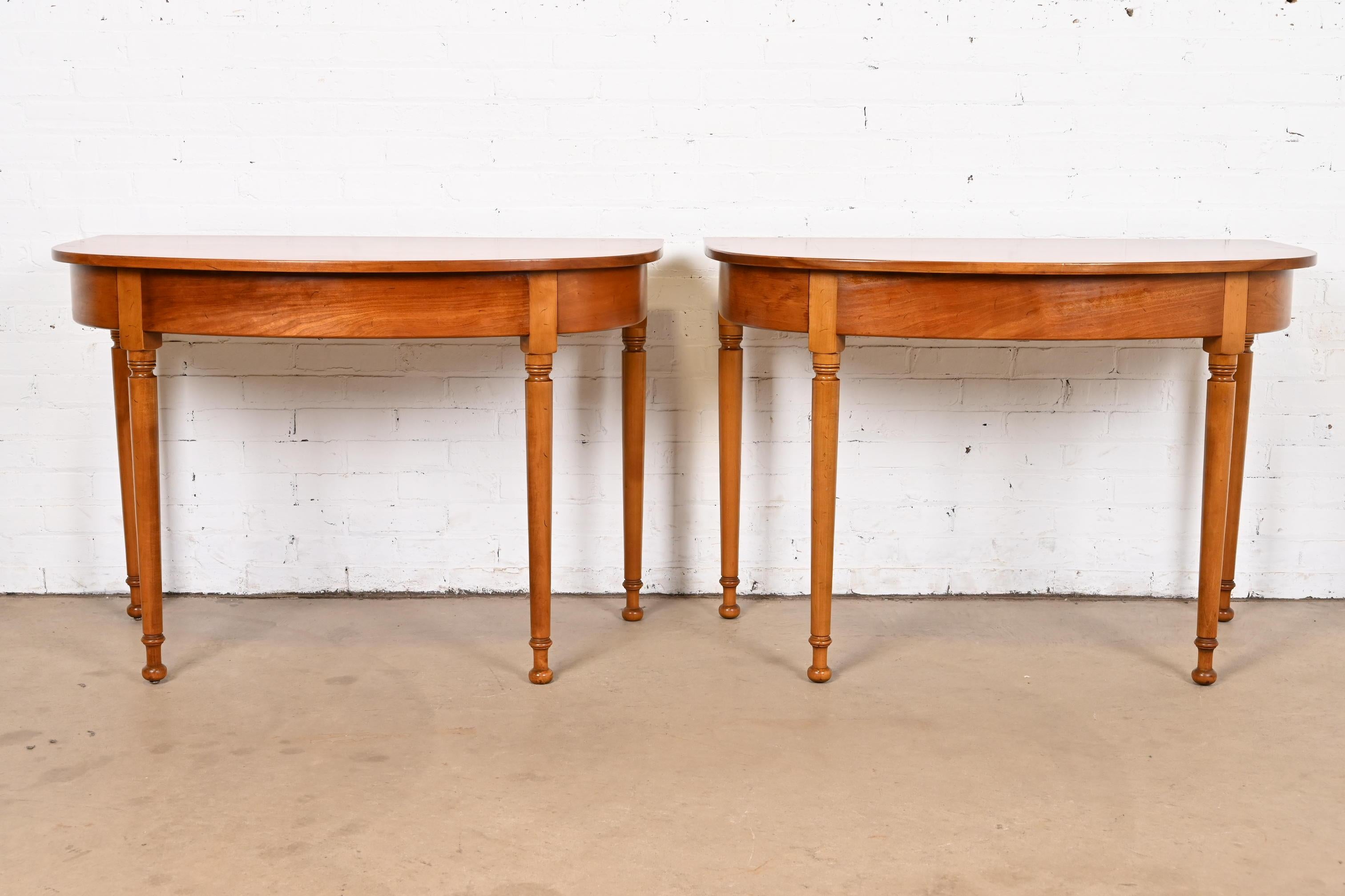 A gorgeous pair of American Colonial style demilune console tables or entry tables

By L. & J.G. Stickley

USA, Circa 1960s

Each measures: 44