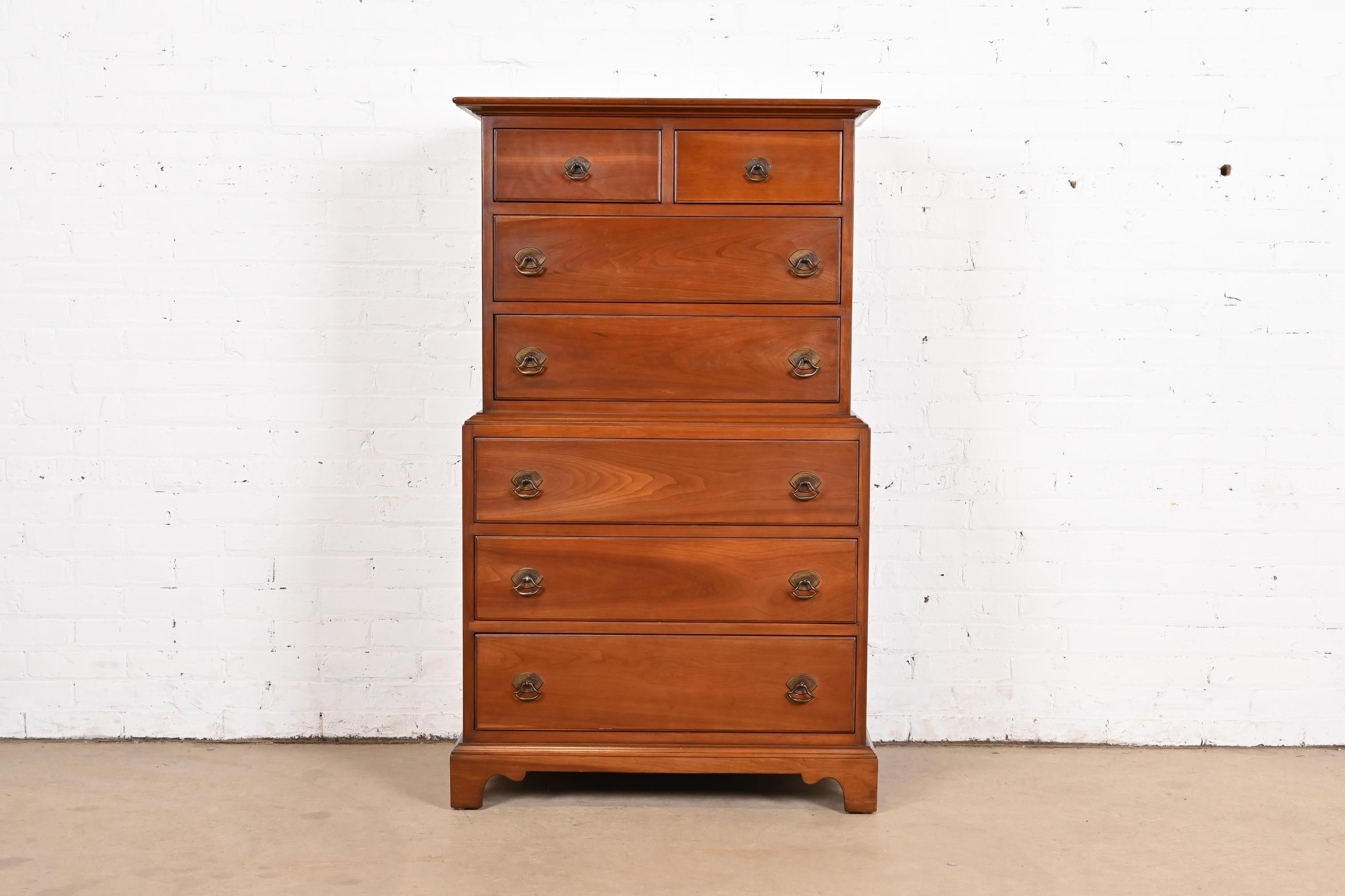A gorgeous American Colonial or Chippendale style seven-drawer highboy dresser or chest of drawers

By L. & J.G. Stickley

USA, Circa 1950s

Solid cherry wood, with original brass hardware.

Measures: 31.63