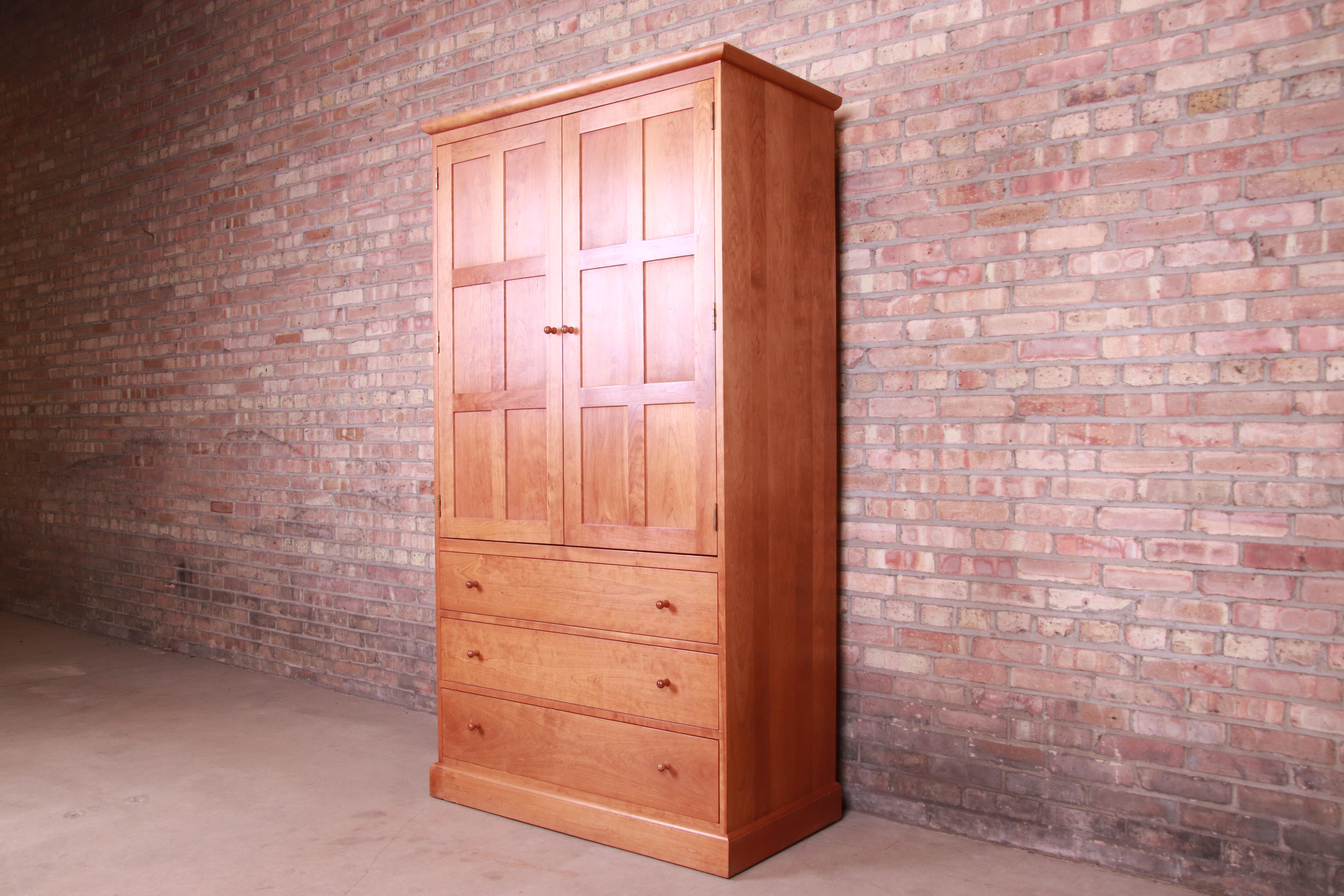 An exceptional Arts & Crafts or Shaker style solid cherry wood armoire dresser or gentleman's chest

By L. & J.G. Stickley

USA, Late 20th Century

Measures: 42