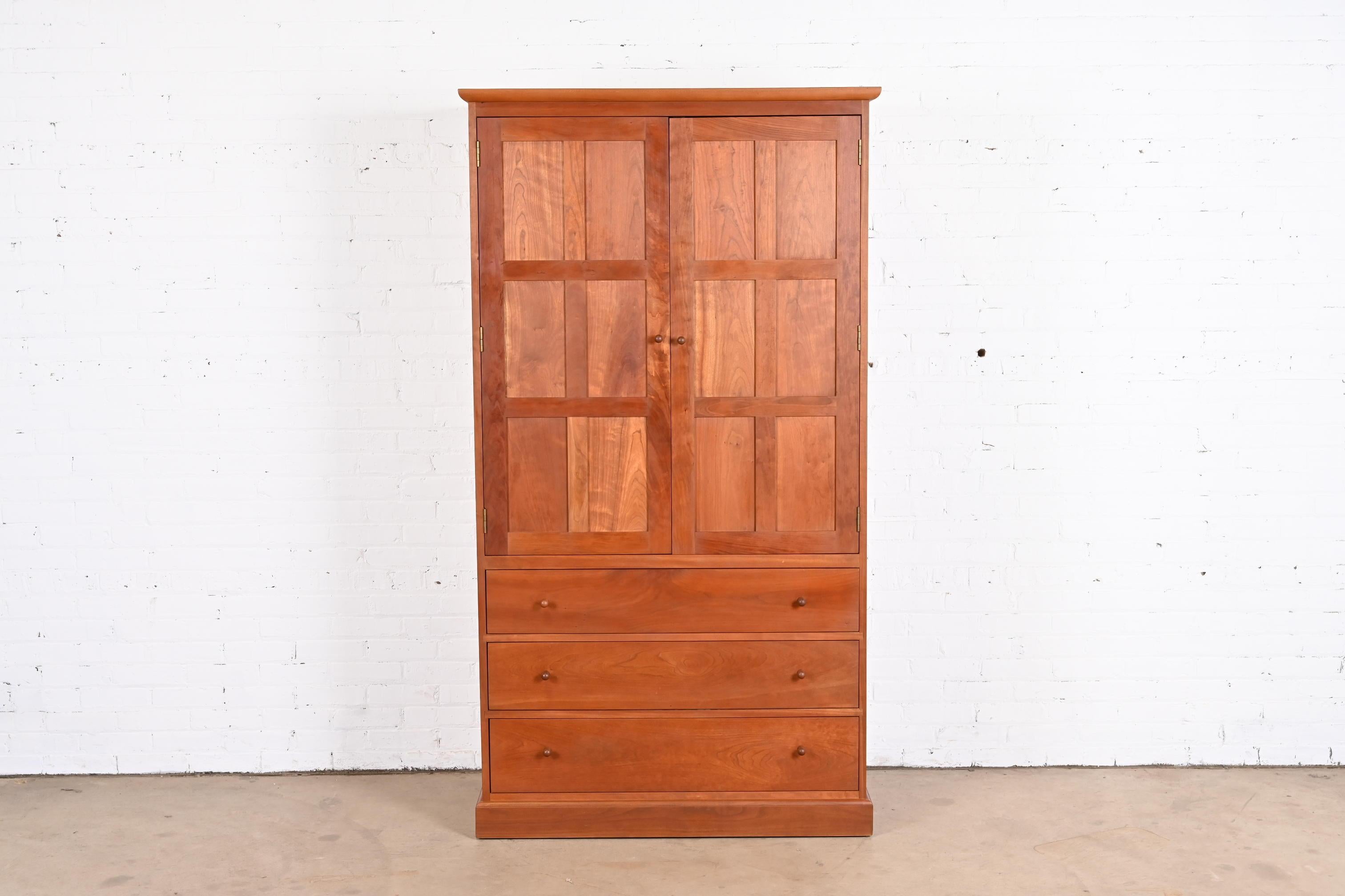 An exceptional Arts & Crafts or Shaker style solid cherry wood armoire dresser or gentleman's chest

By L. & J.G. Stickley

USA, Late 20th Century

Measures: 42