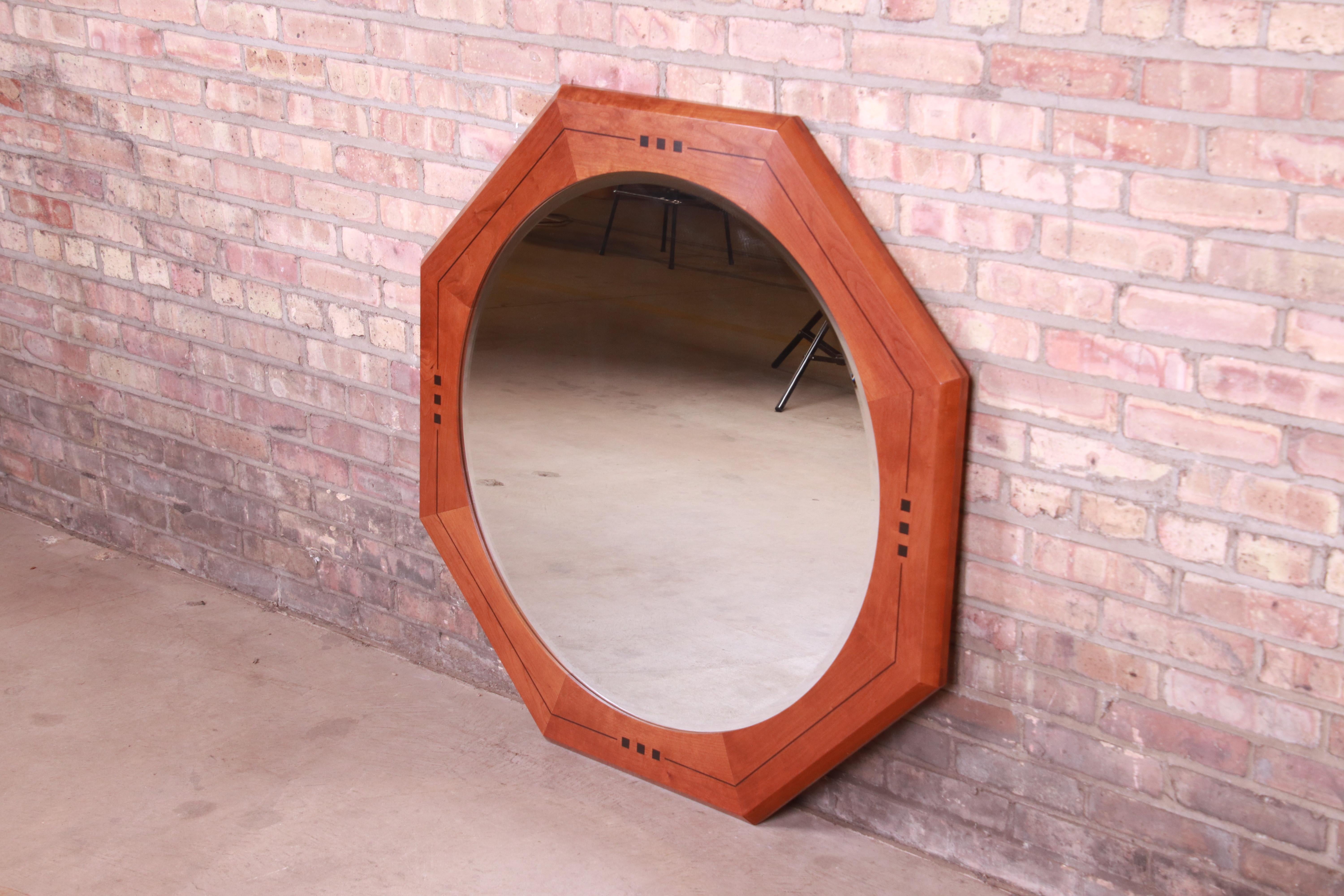 A gorgeous Arts & Crafts style wall mirror

By L. & J.G. Stickley

USA, 2001

Solid cherry wood frame with inlaid ebony details and inset round beveled mirror.

Measures: 41