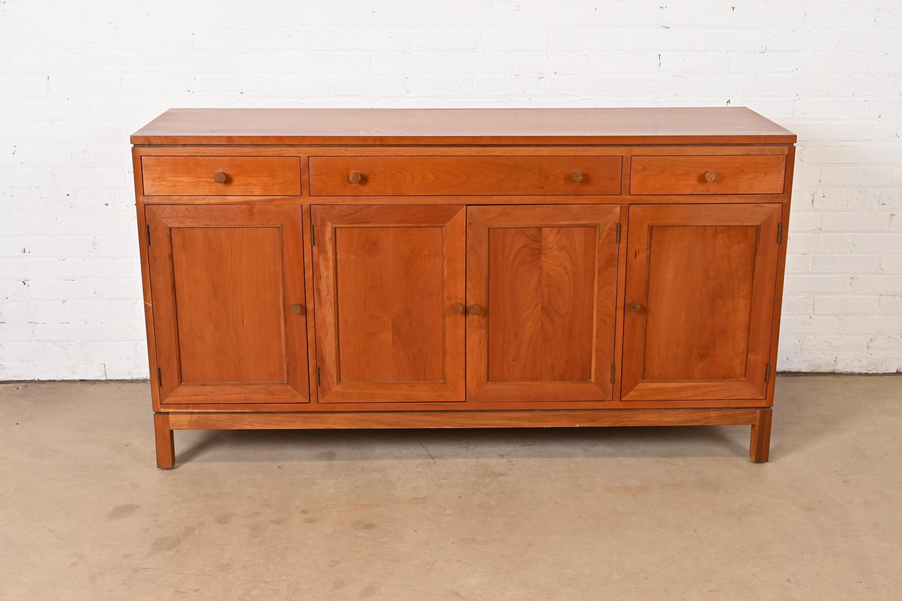 A gorgeous Arts & Crafts or Shaker style cherry wood sideboard, credenza, or bar cabinet

By Stickley

USA, Circa Late 20th Century

Measures: 64.25