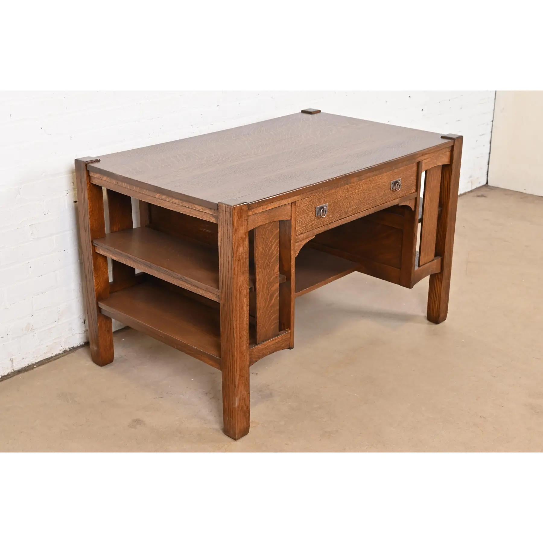 An exceptional antique Mission or Arts & Crafts writing desk or library table with built-in bookcases

By Stickley Brothers

USA, Circa 1900

Quarter sawn oak, with hammered copper hardware.

Measures: 47.75