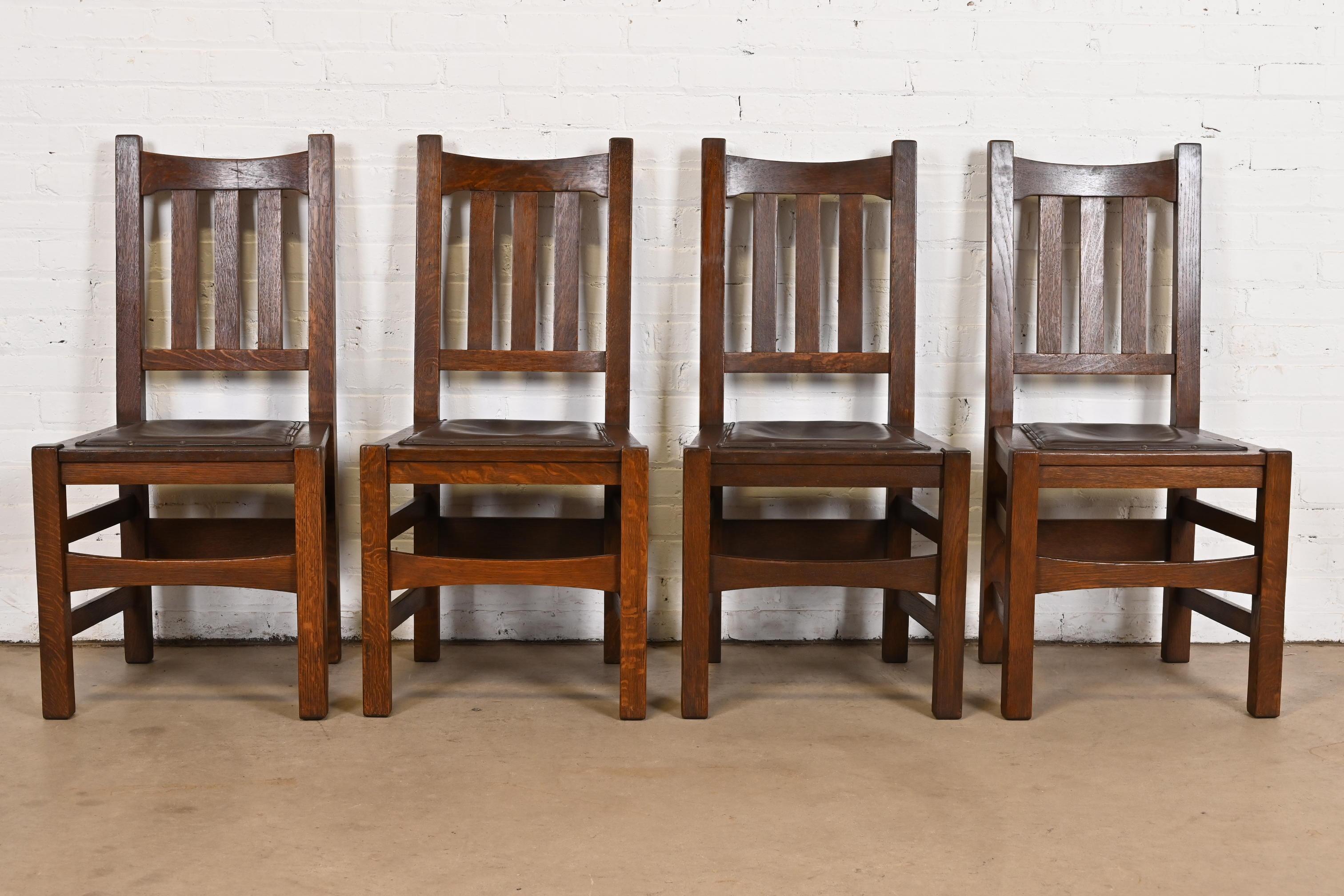 A rare and exceptional set of four antique Mission or Arts & Crafts dining chairs

By Stickley Brothers

USA, Circa 1900

Solid quarter sawn oak frames, with leather seats.

Measures: 18.38