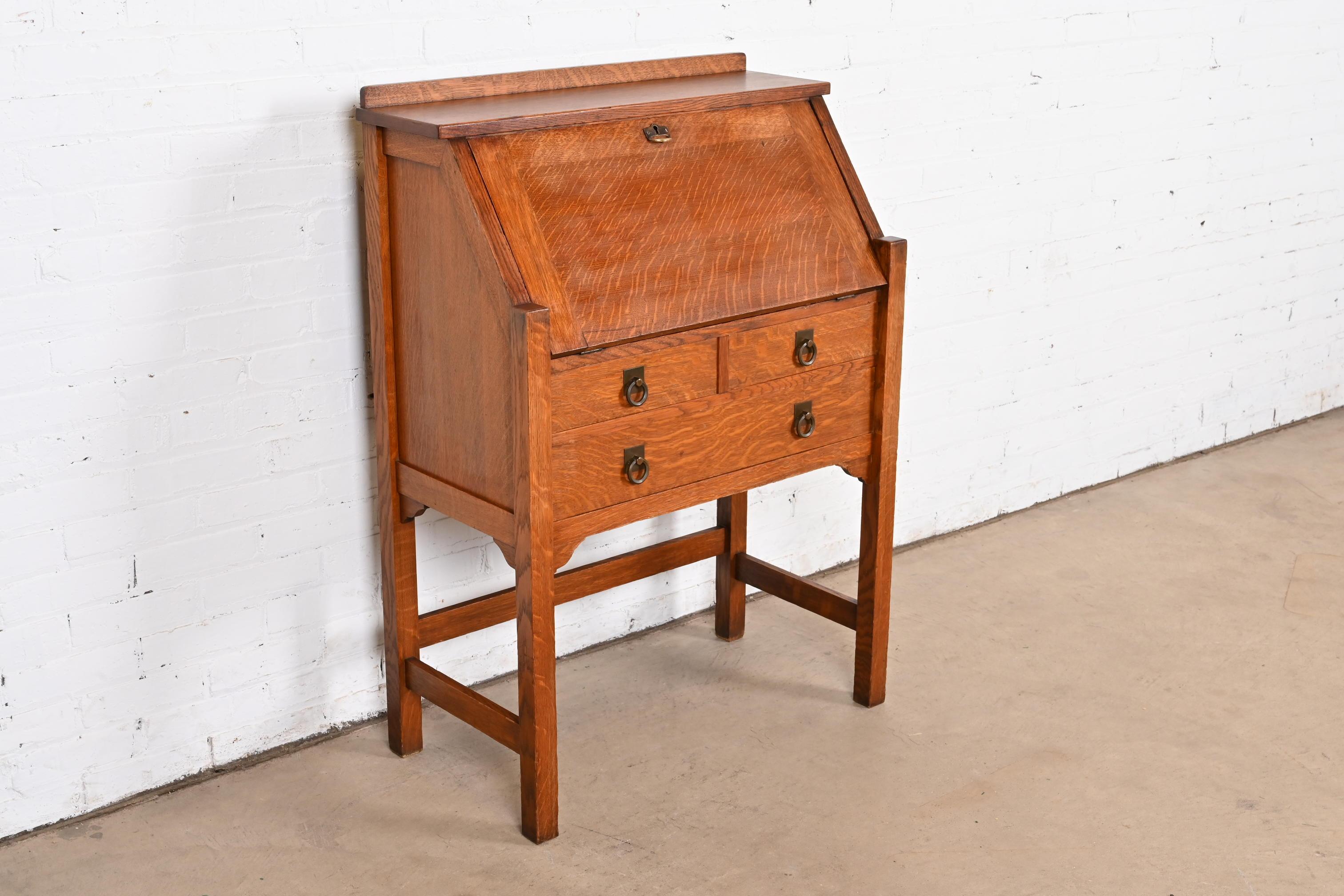 A gorgeous antique Mission or Arts & Crafts slant front writing desk.

By Stickley Brothers

USA, Early 20th Century

Quarter sawn oak, with original hammered copper hardware.

Measures: 30.5