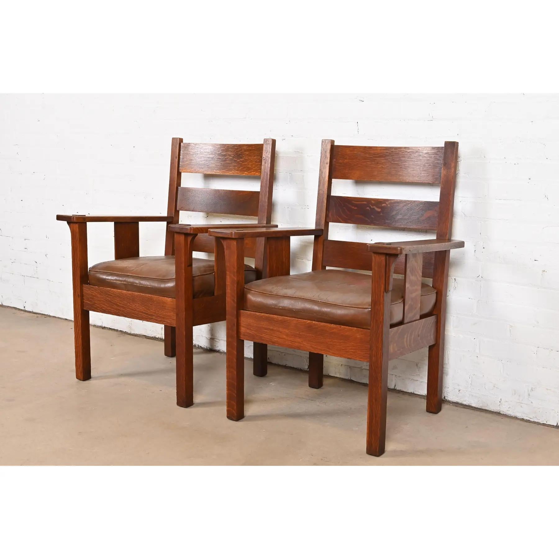 A rare and exceptional pair of Mission or Arts & Crafts period club chairs or armchairs

By Stickley Brothers

USA, Circa 1900

Solid quarter sawn oak frames, with leather upholstered seats.

Measures: 28.5