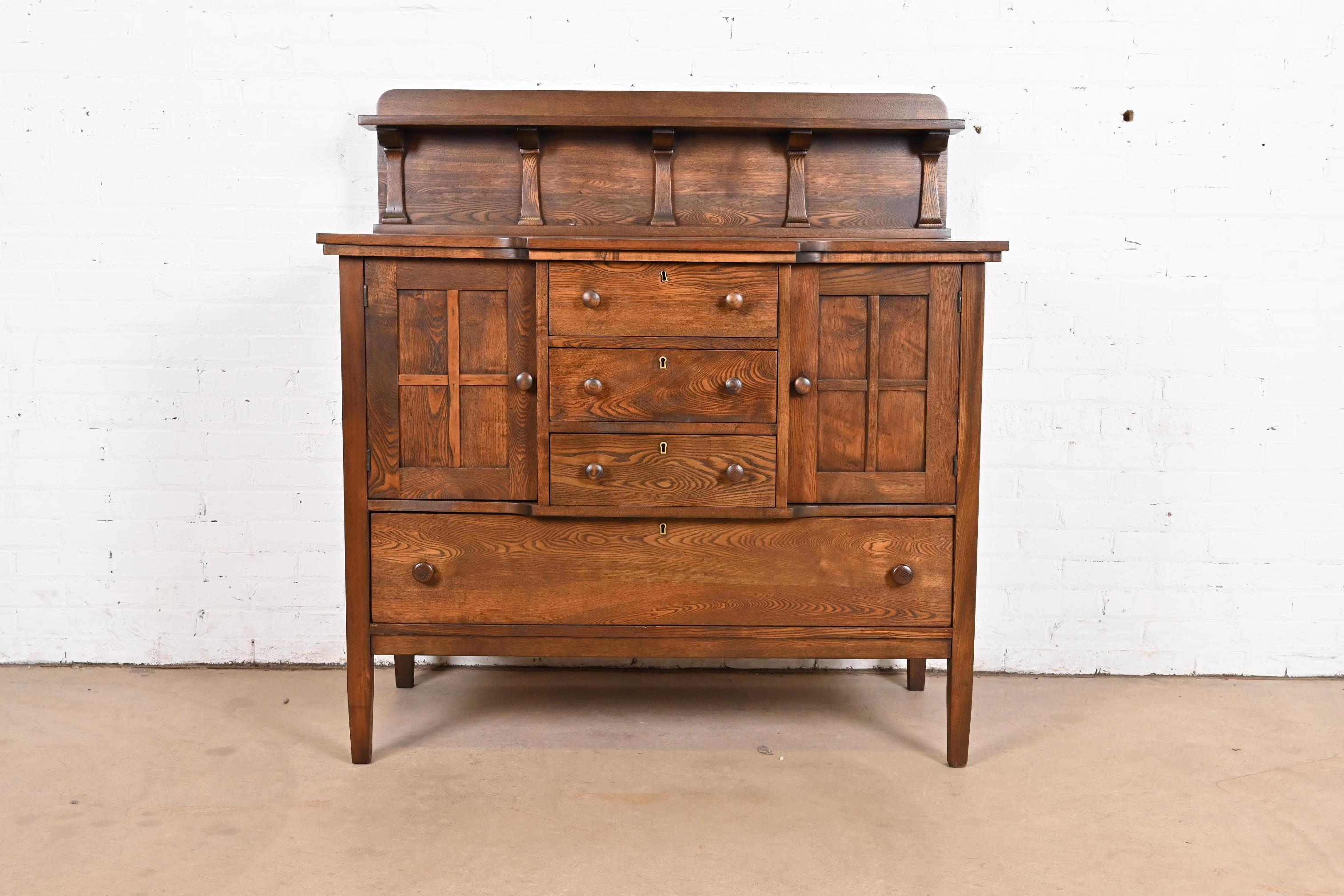 An exceptional antique Mission or Arts & Crafts oak sideboard, credenza, or bar cabinet

By Stickley Brothers

USA, Circa 1900

Measures: 48
