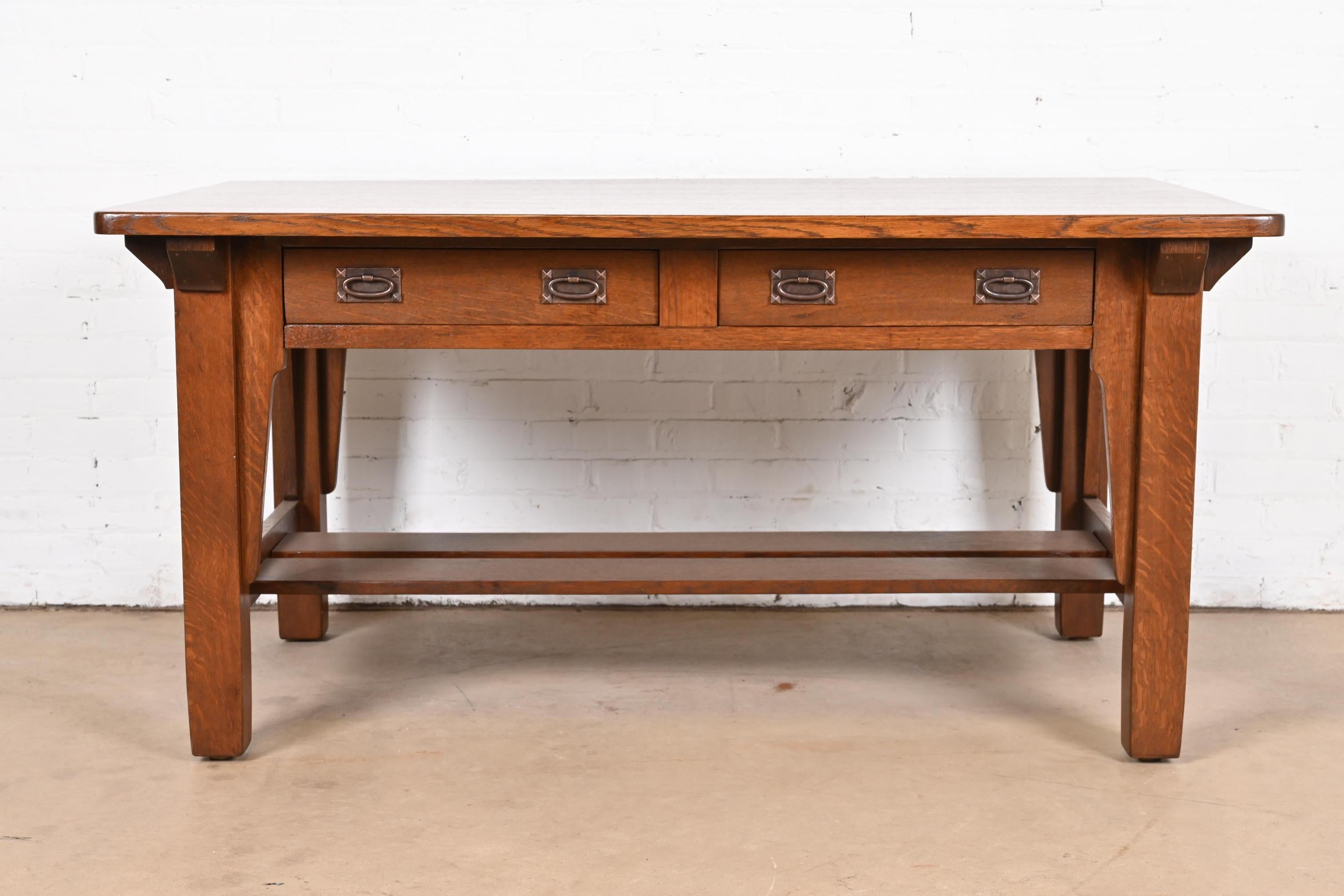 An exceptional antique Mission or Arts & Crafts writing desk or library table

By Stickley Brothers

USA, Circa 1900

Solid quarter sawn oak, with hammered copper hardware.

Measures: 60