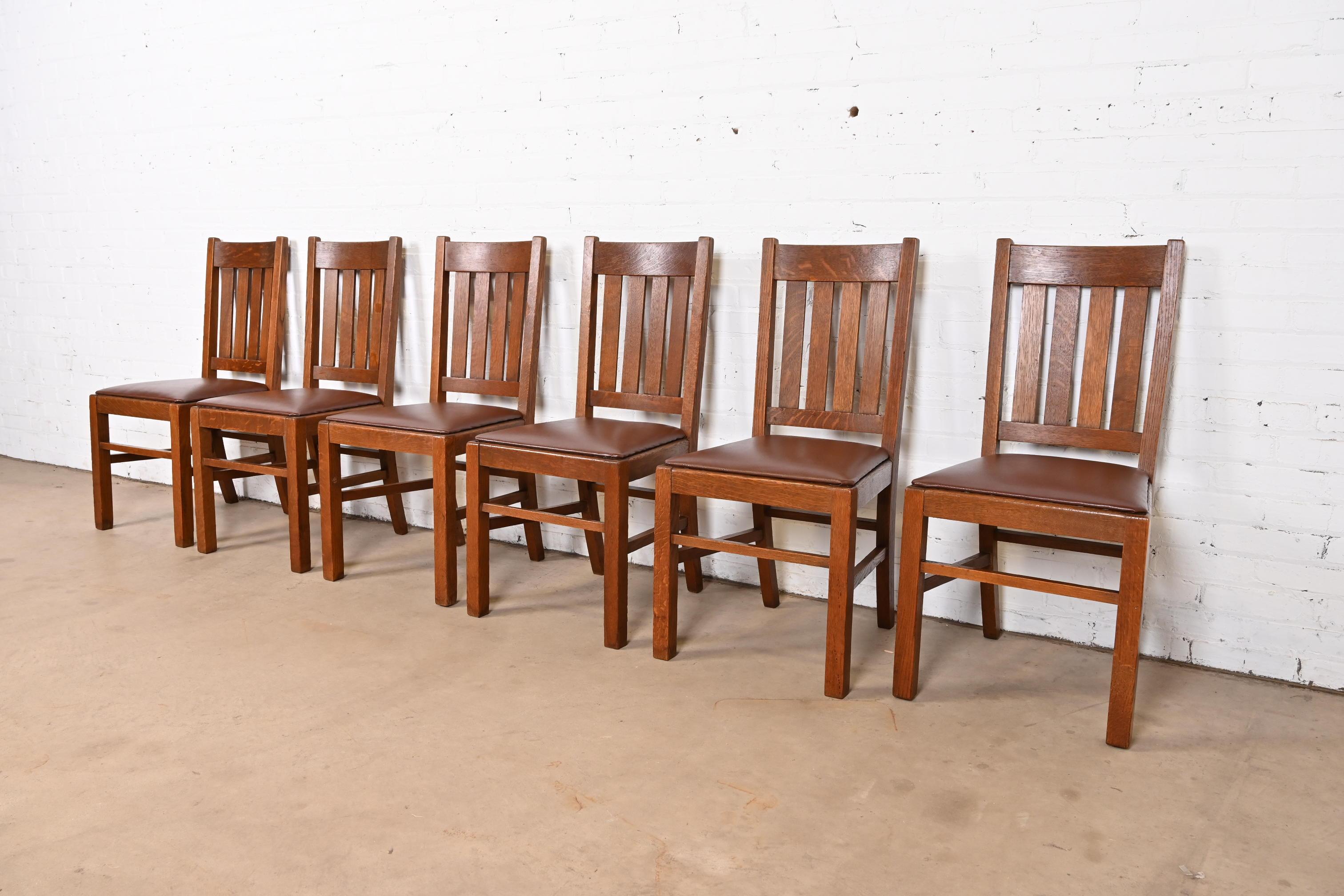 A gorgeous set of six antique Mission or Arts & Crafts dining chairs

In the manner of Stickley Brothers

USA, Early 20th Century

Solid quarter sawn oak frames, with leather seats.

Measures: 18.25