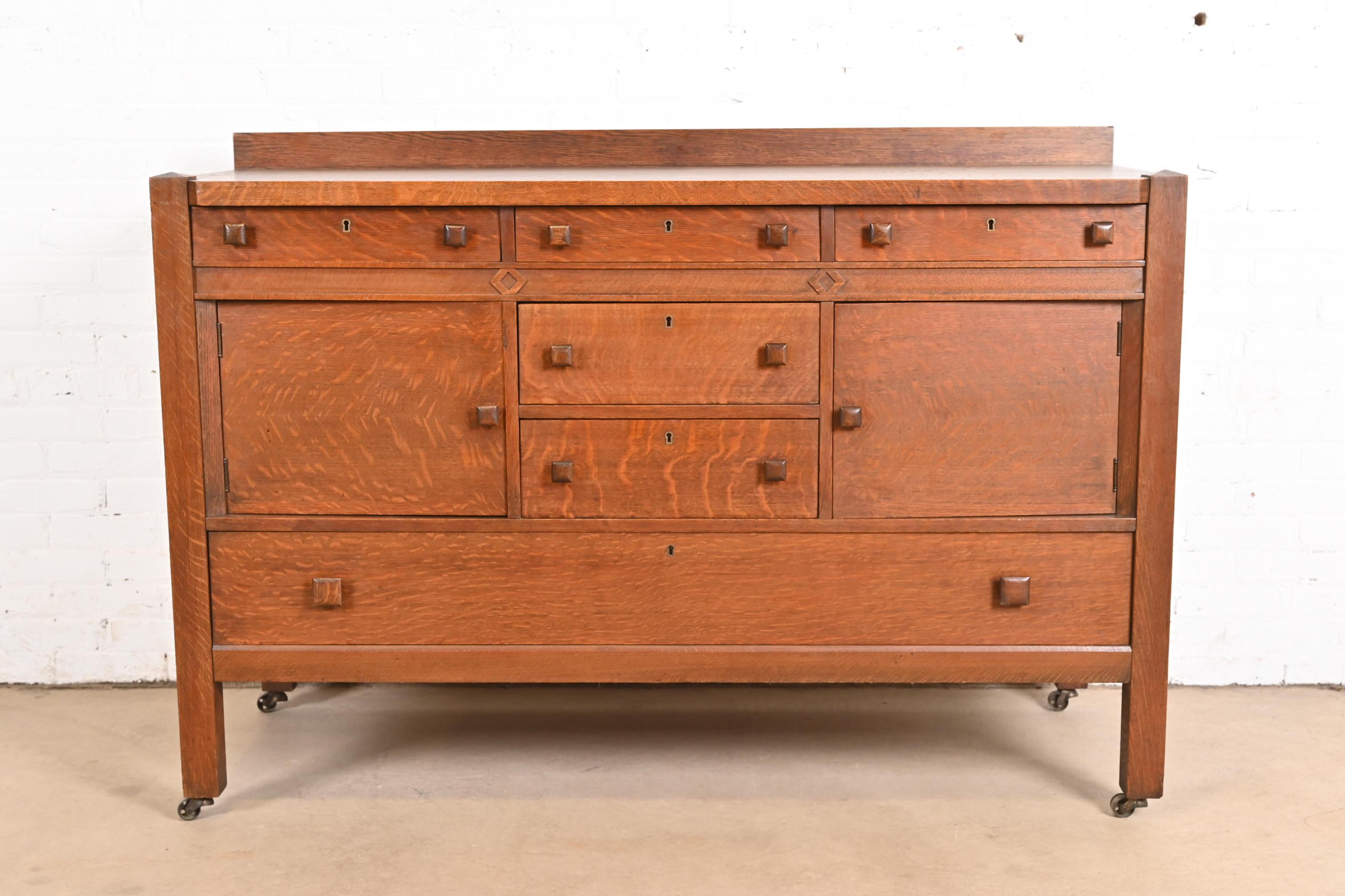 A gorgeous antique Mission or Arts & Crafts tiger oak sideboard, buffet server, or bar cabinet

In the manner of Stickley Brothers

USA, Circa 1900

Measures: 60
