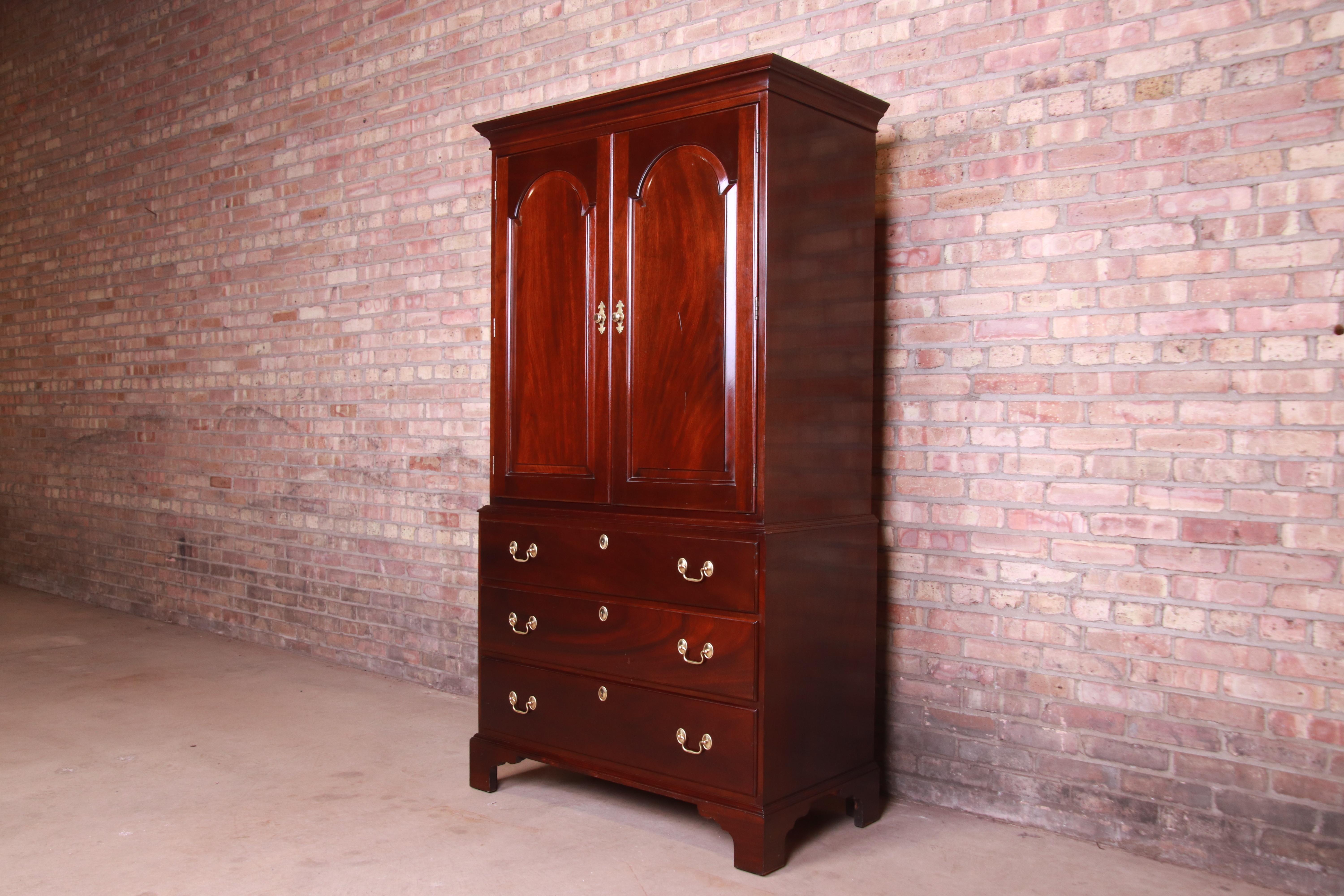 A gorgeous Chippendale style armoire dresser or gentleman's chest.

By L. & J.G. Stickley,

USA, late 20th century

Solid mahogany, with original brass hardware.

Measures: 39.13