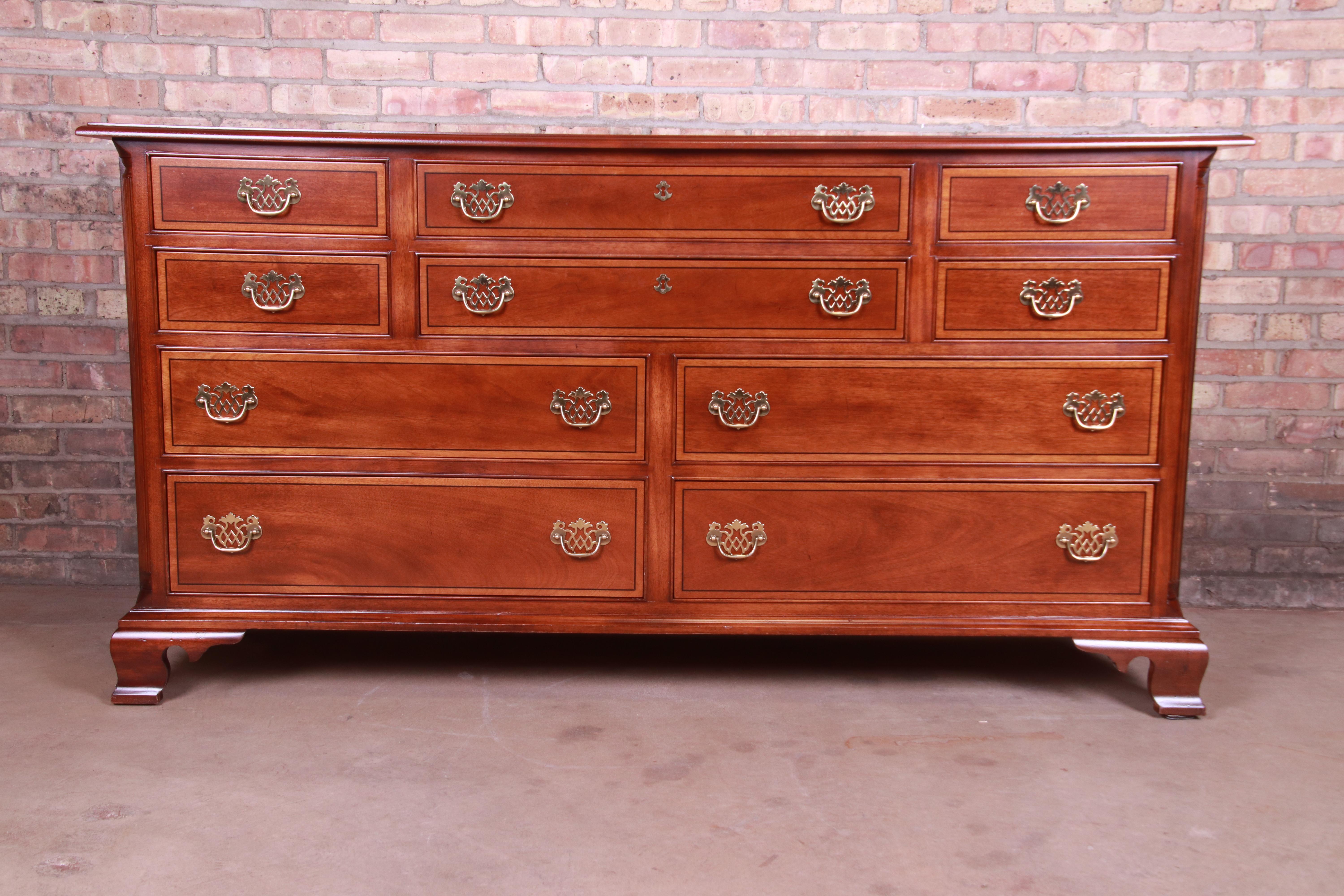 A gorgeous Chippendale style ten-drawer dresser or credenza

By L. & J.G. Stickley

USA, 20th century

Solid mahogany, with original brass hardware.

Measures: 69