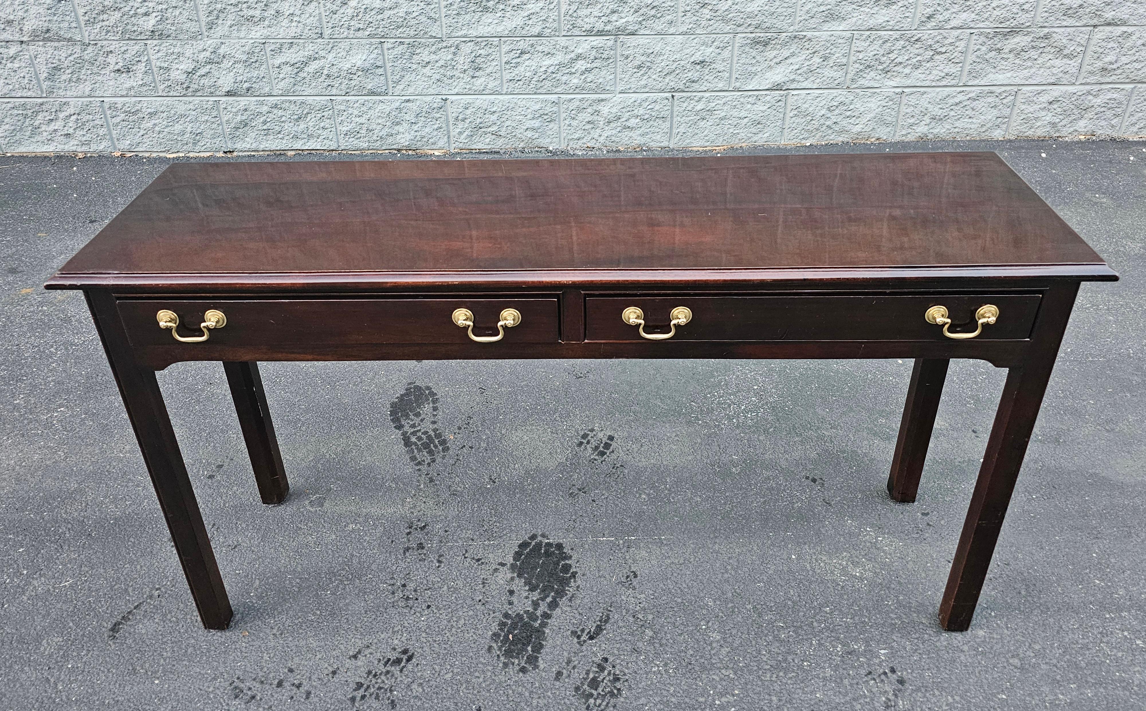 A late 20th Century Stickley Chppendale Solid Mahogany Console Table with Ptrotective Glass Top. Solid Dark Mahogany with brass drawer pulls. Dovetailed drawers working flawlessly.
 Measures 53.5