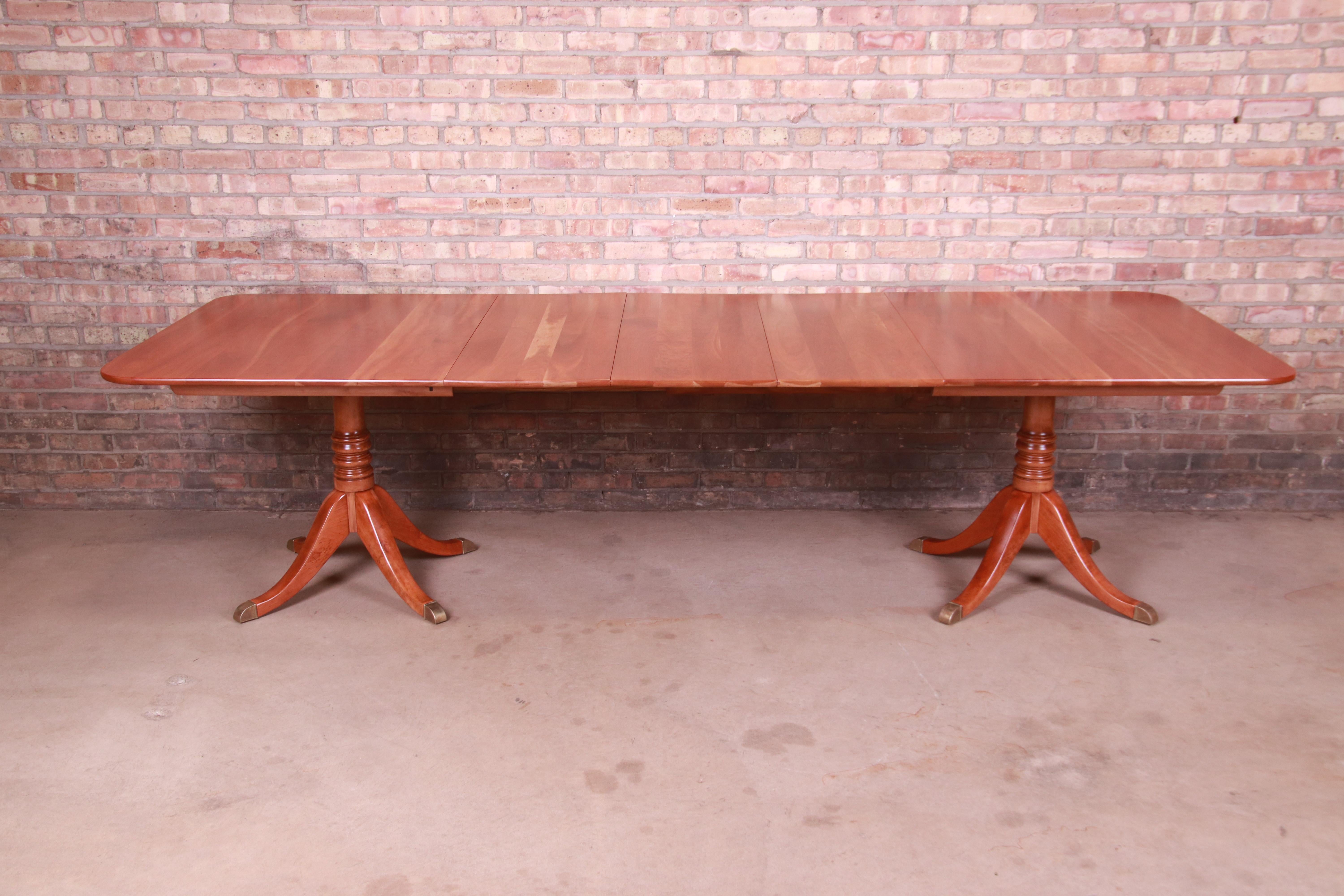 A gorgeous Georgian style double pedestal extension dining table

By L. & J.G. Stickley

USA, Circa 1950s

Solid natural cherry wood, with brass-capped feet.

Measures: 67.25