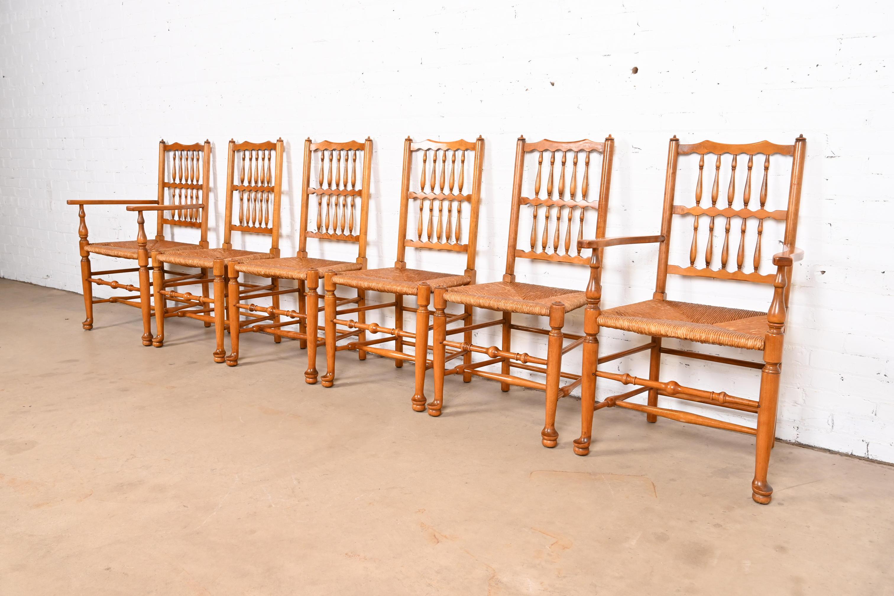 An exceptional set of six Lancashire style dining chairs

By L. & J.G. Stickley

USA, 1954

Solid carved cherry wood frames, with rush seats.

Measures:
Side chairs - 21.13