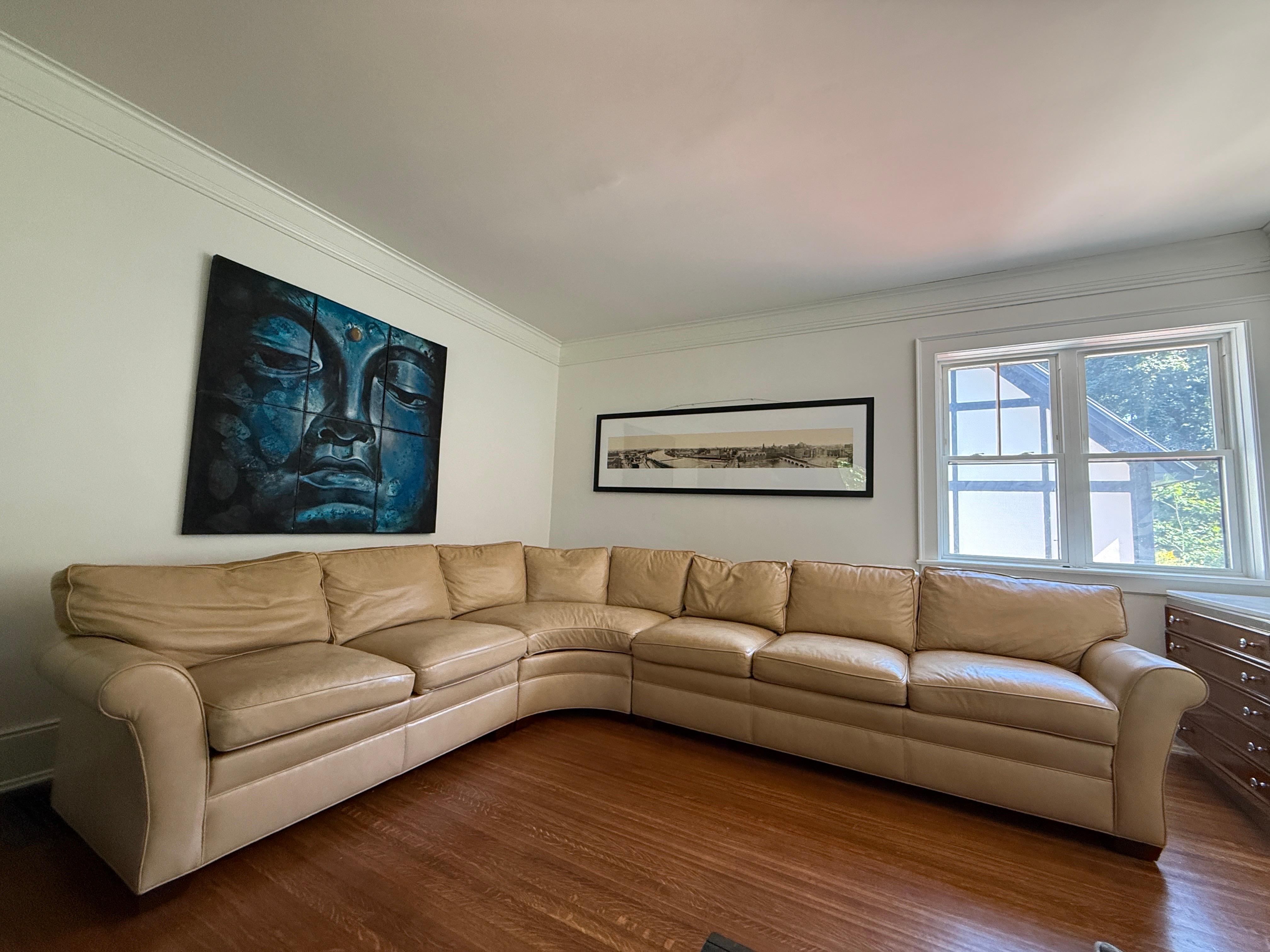 Stickley Wrap Around stunning sofa that can seat a large group, 7 large pillows wrap around the curved leather sectional. A classic Ralph Lauren style vintage gem! 

Dimensions 
The longer side is 125 inches long while the shorter side is 100 inches