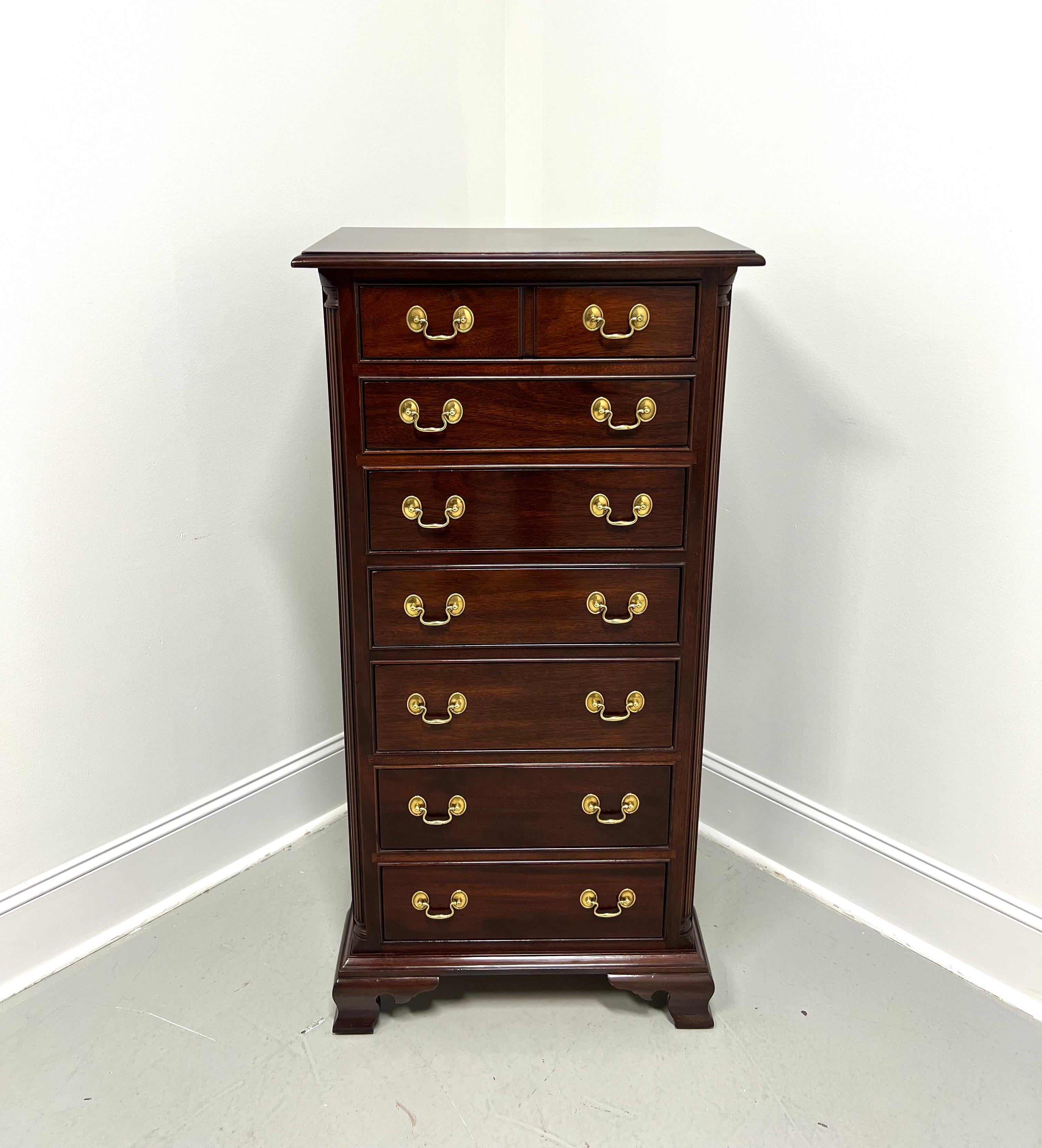 A Chippendale style semainier lingerie chest Stickley Furniture. Solid mahogany with brass hardware, bevel edge to top, fluted columns to front sides, and ogee bracket feet. Features seven drawers of dovetail construction, with top drawer having a